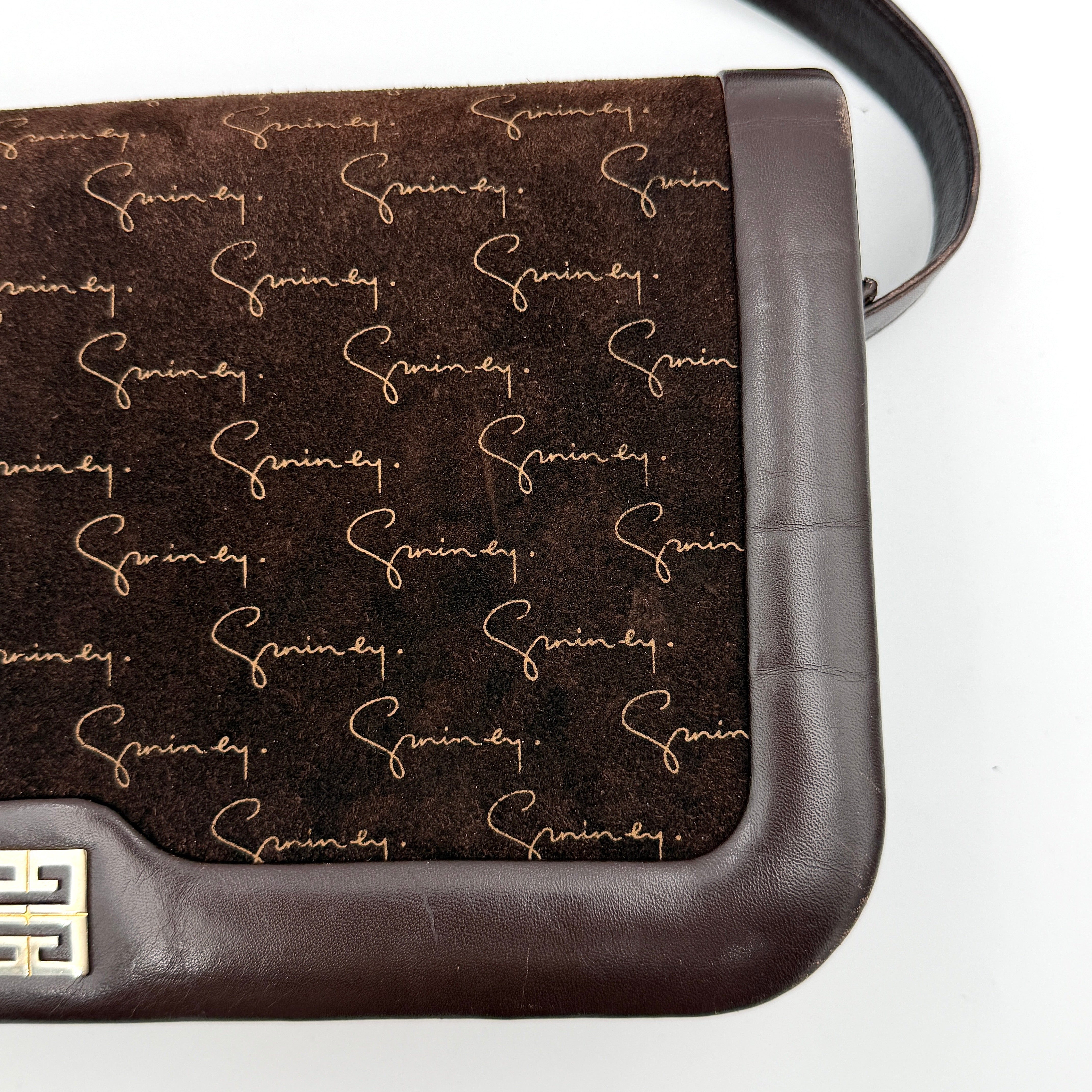Givenchy 4G Monogram brown suede shoulder bag with leather trim and silver-tone clasp, photographed on a white background.