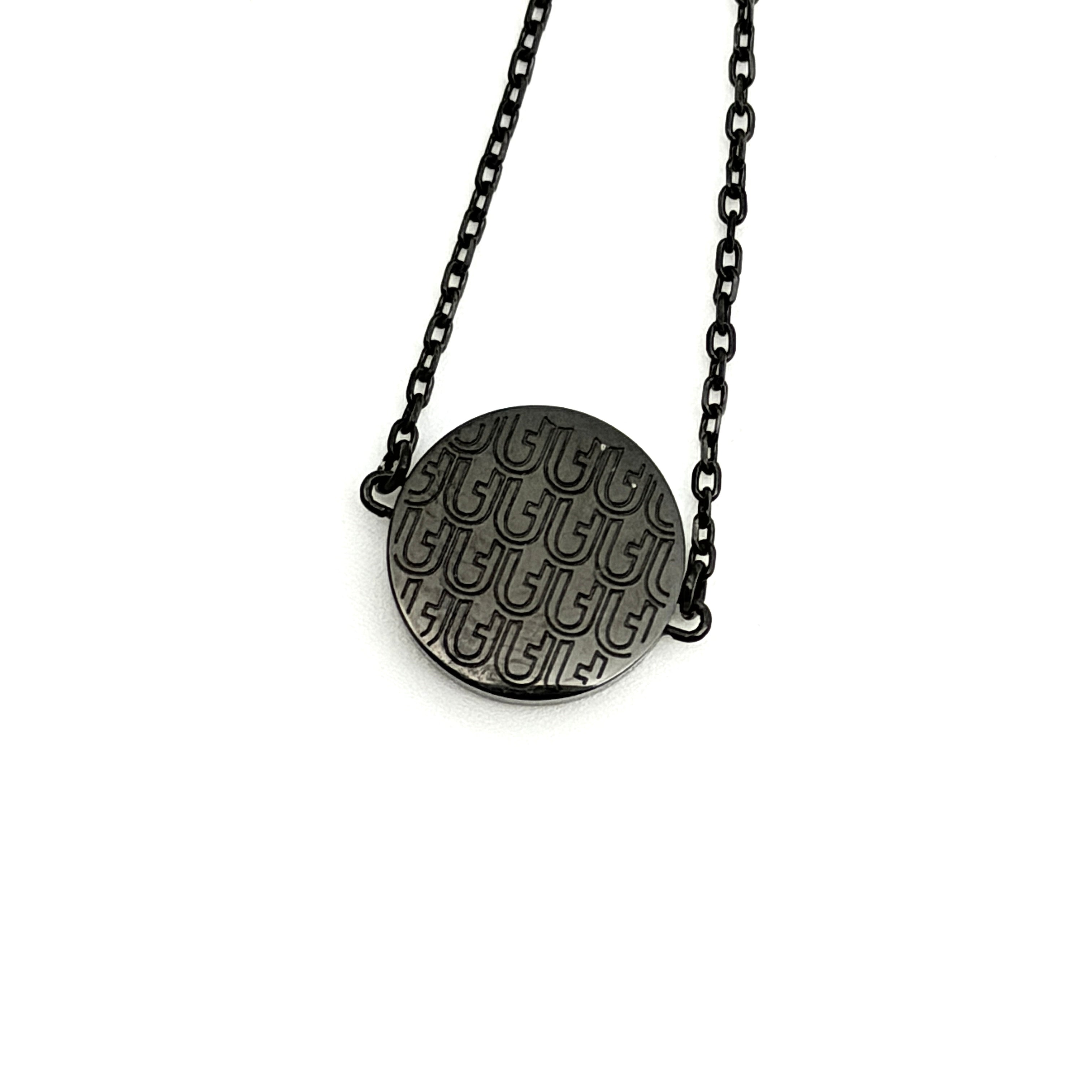 Furla Sigillo black crystal bracelet displayed on branded pouch with authenticity card