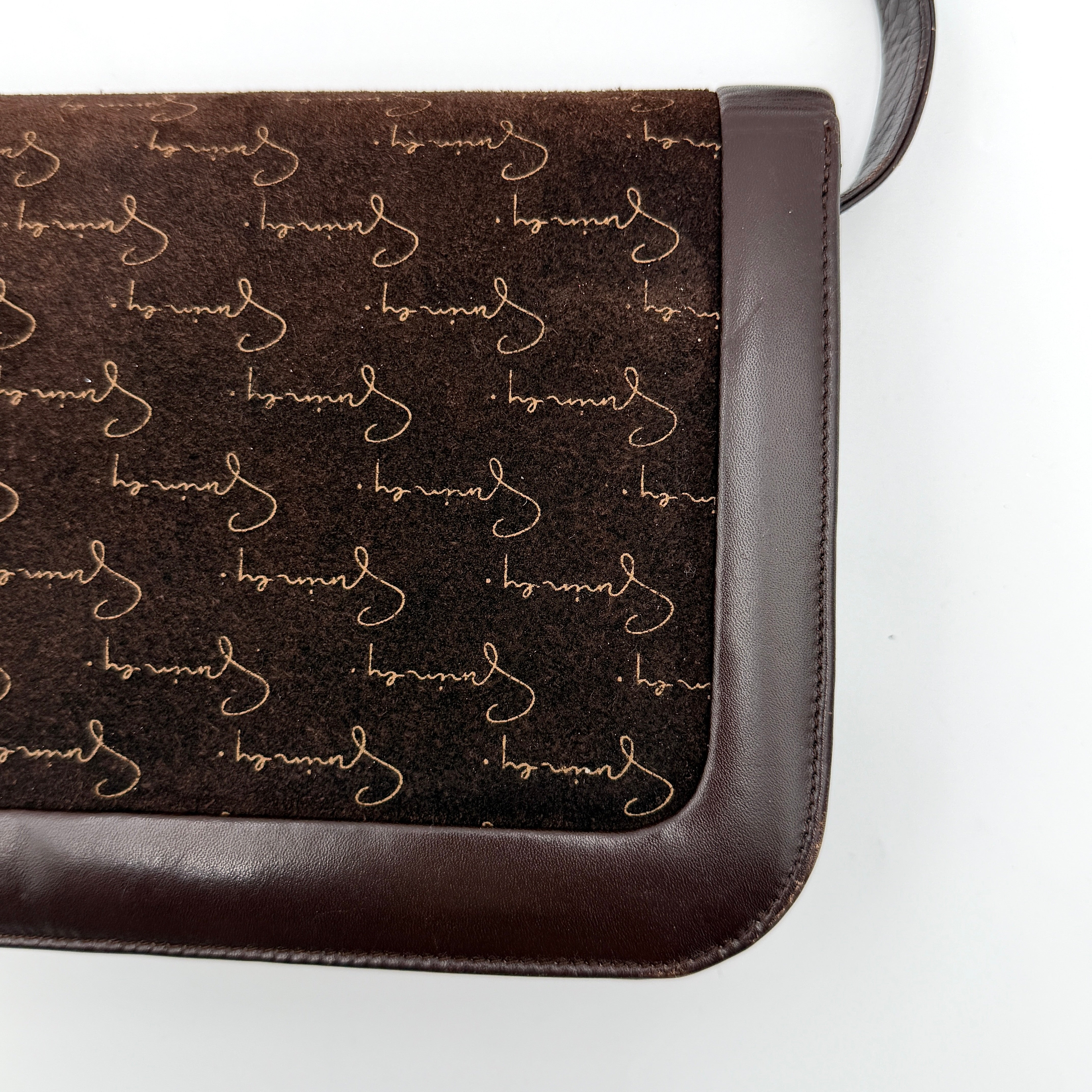 Givenchy 4G Monogram brown suede shoulder bag with leather trim and silver-tone clasp, photographed on a white background.