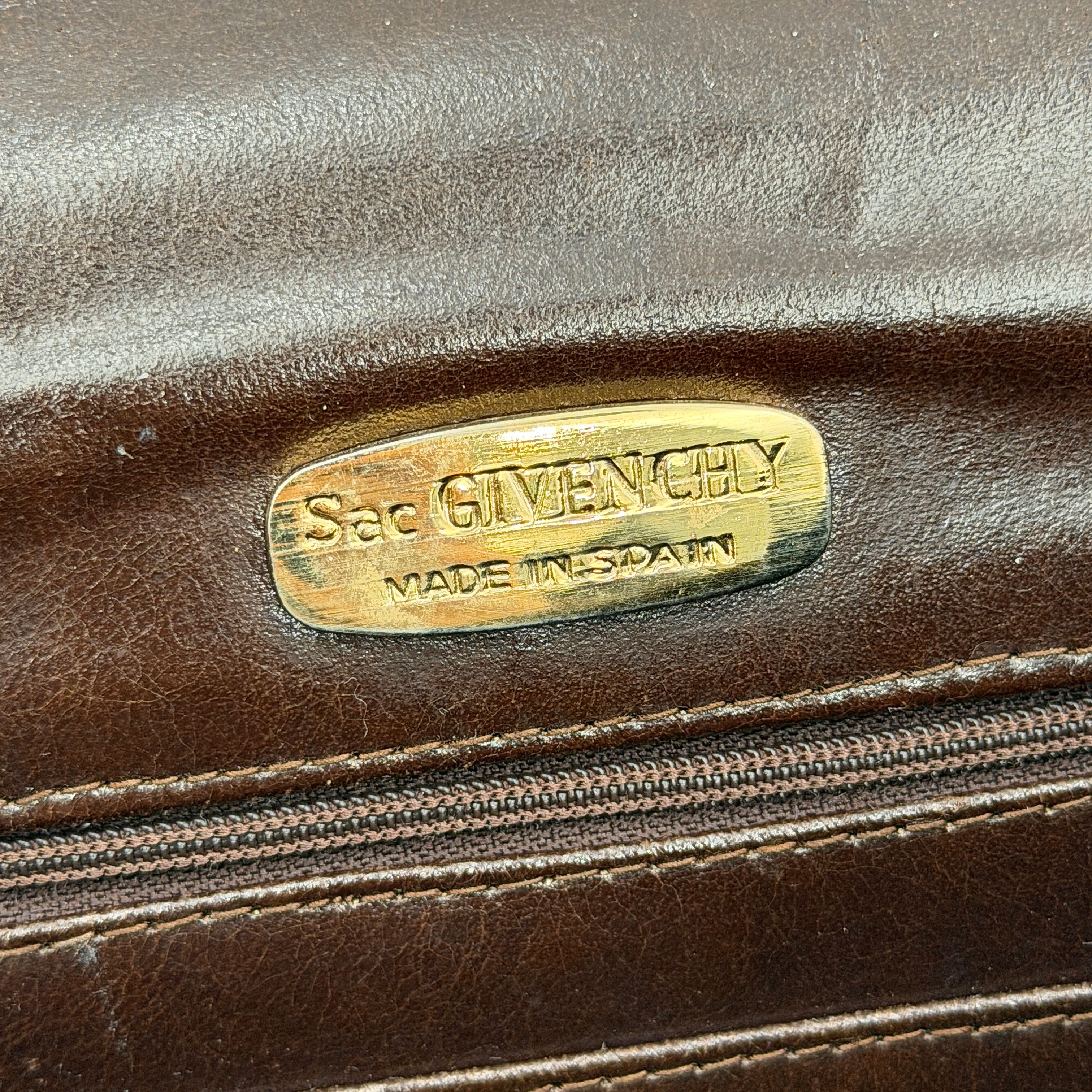 Givenchy 4G Monogram brown suede shoulder bag with leather trim and silver-tone clasp, photographed on a white background.