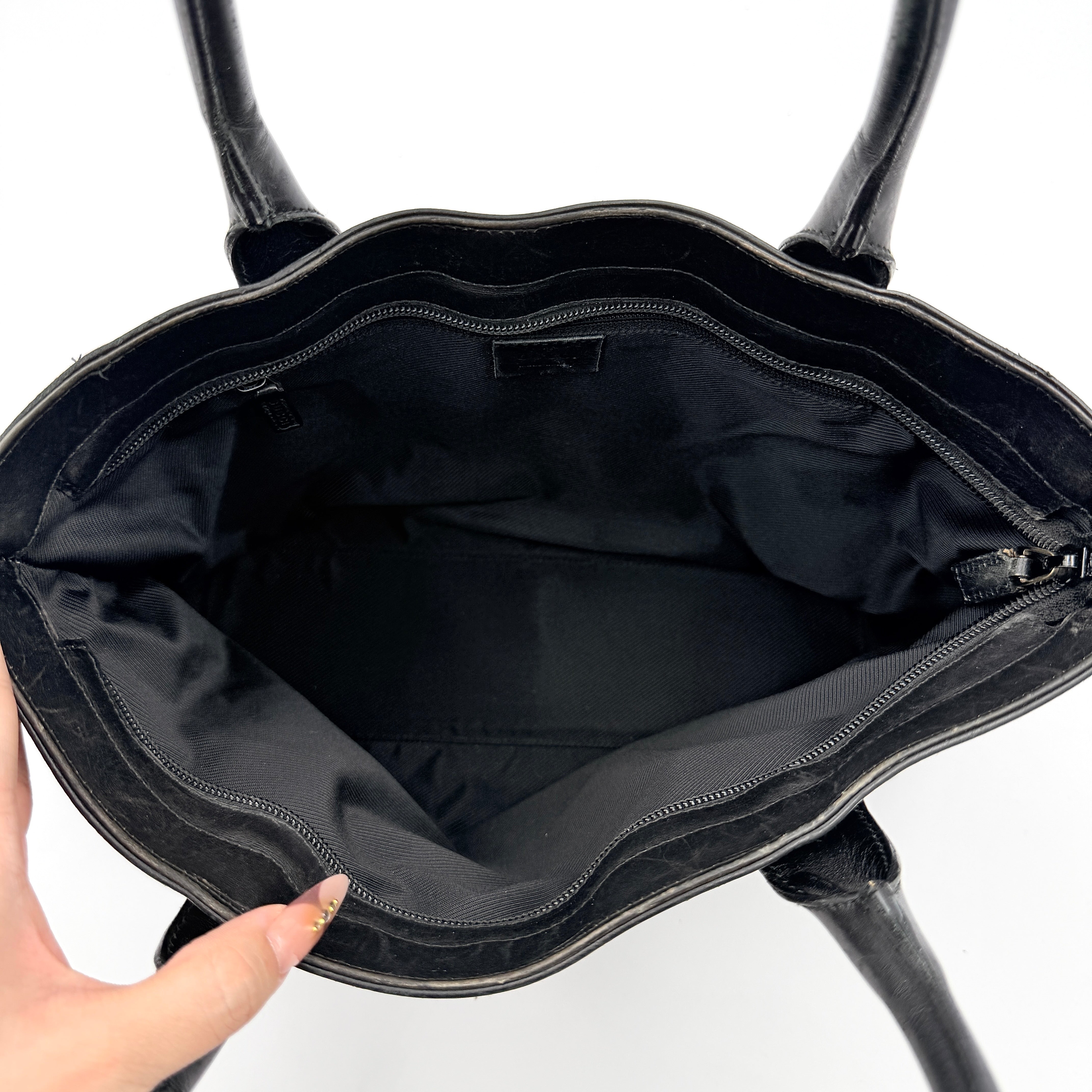 Gucci GG Monogram Leather Tote Bag in black canvas and leather, with structured top handles and allover GG motif.