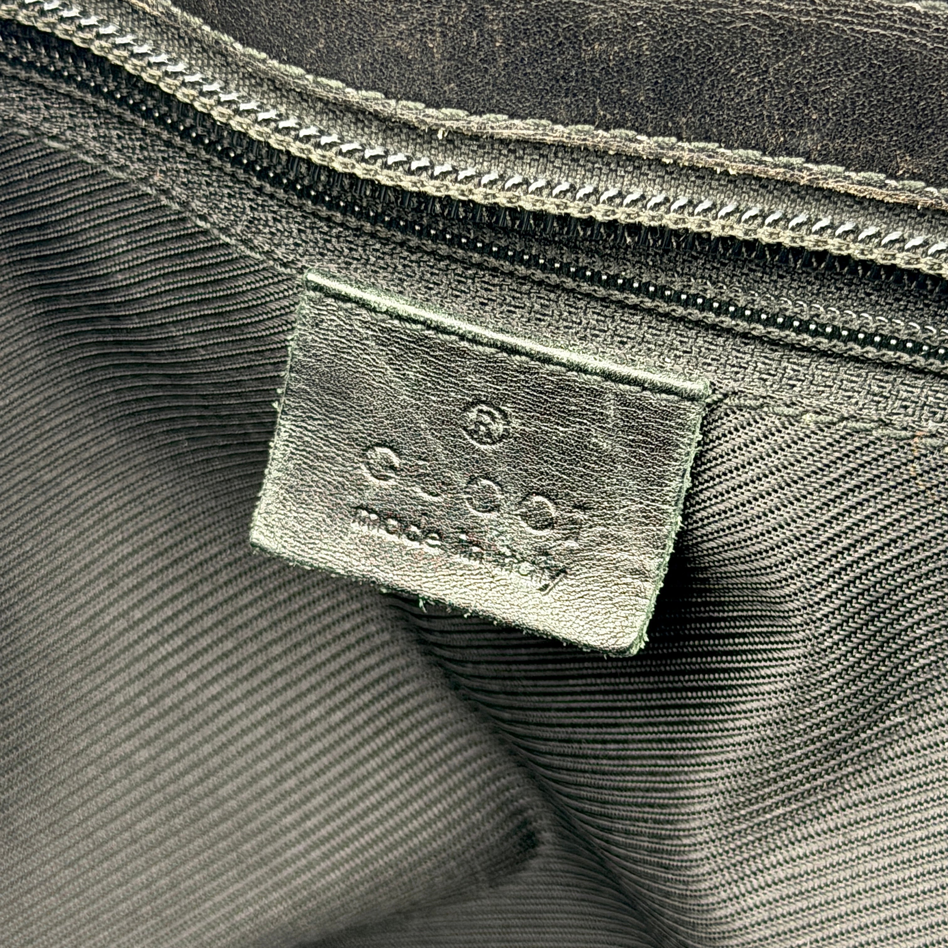 Gucci GG Monogram Leather Tote Bag in black canvas and leather, with structured top handles and allover GG motif.