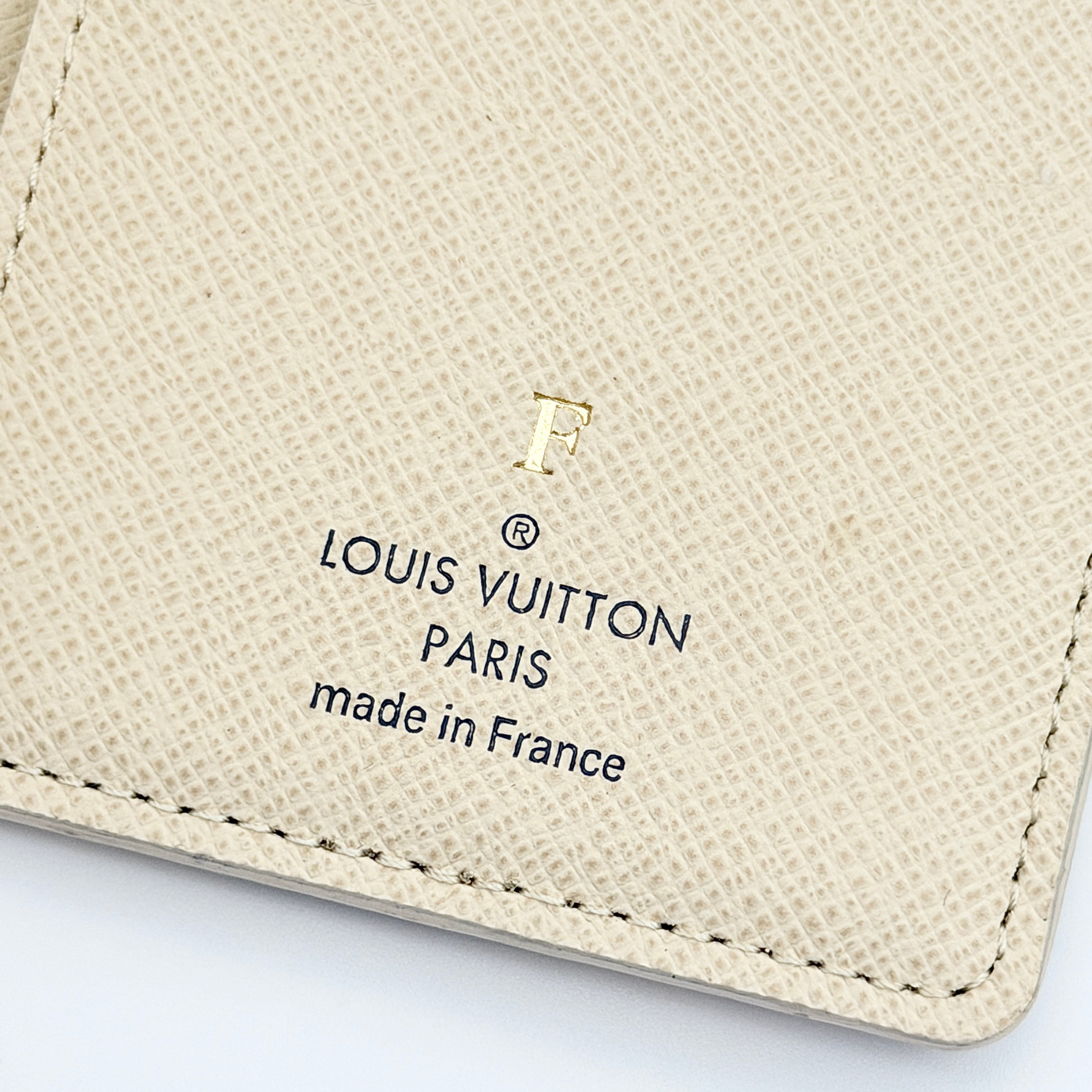 Louis Vuitton Damier Azur Pocket Organiser with box, dust bag, and booklet displayed on a white background.