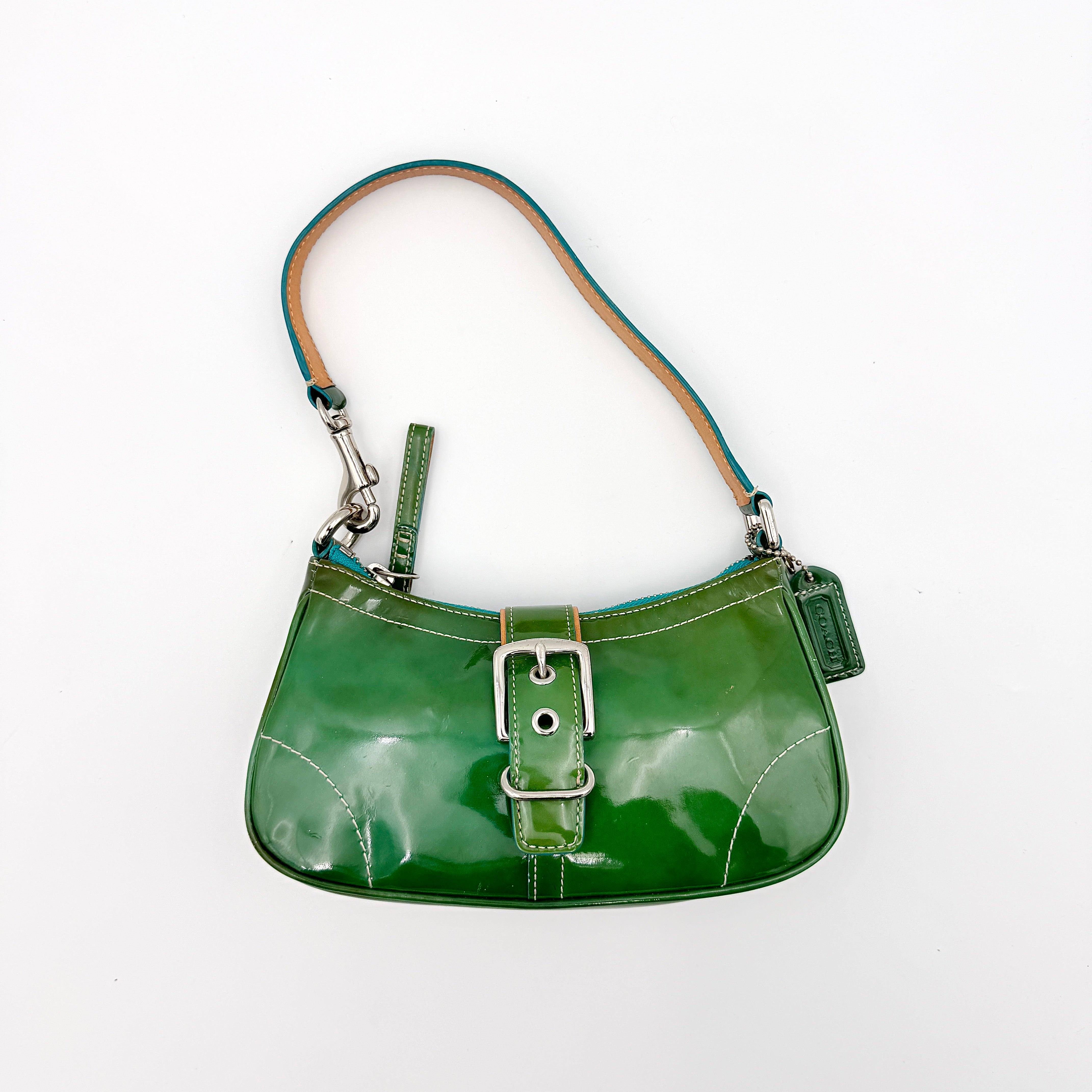 Coach Y2K Demi Soho shoulder bag in glossy green patent leather with silver hardware and natural leather strap.