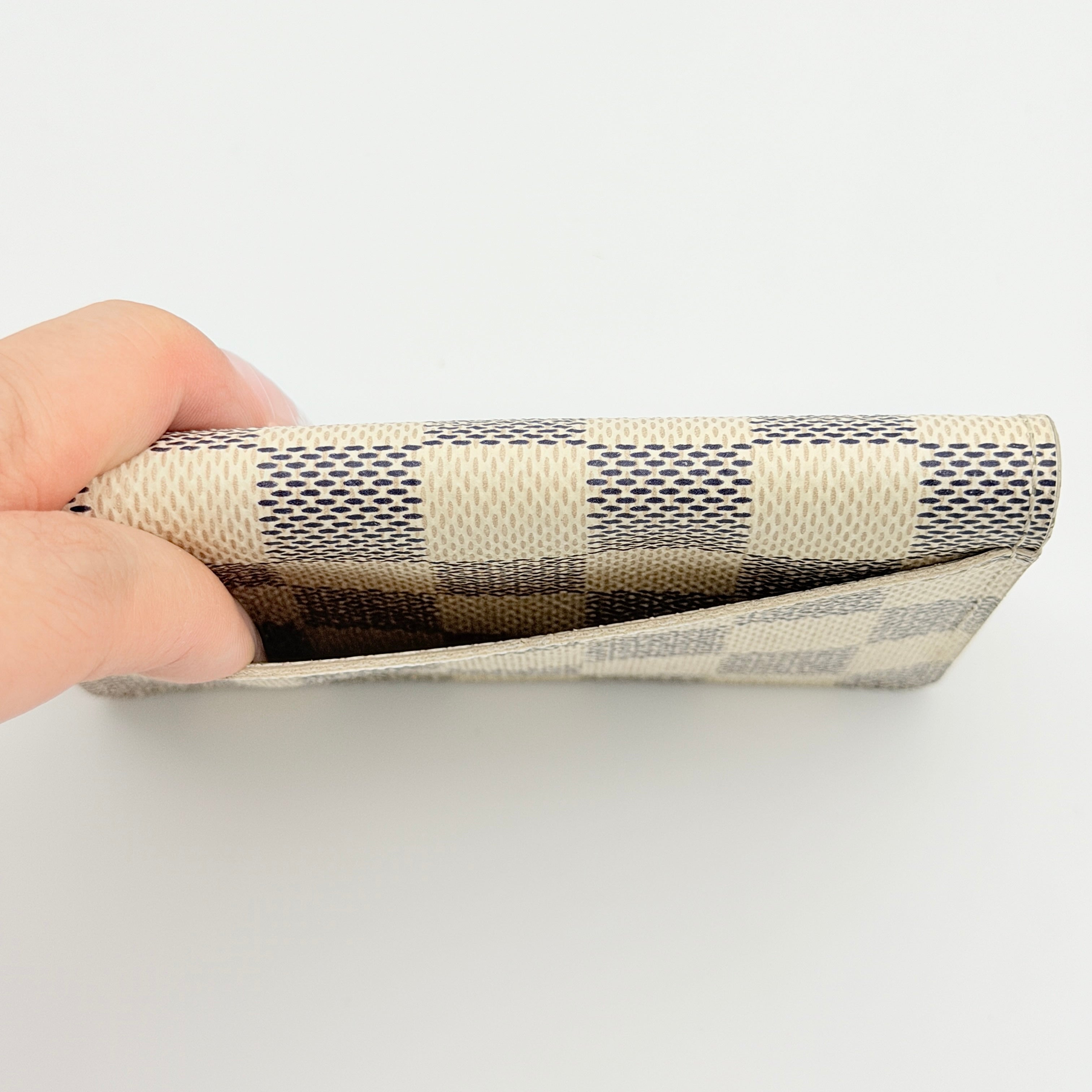 Louis Vuitton Damier Azur Pocket Organiser with box, dust bag, and booklet displayed on a white background.