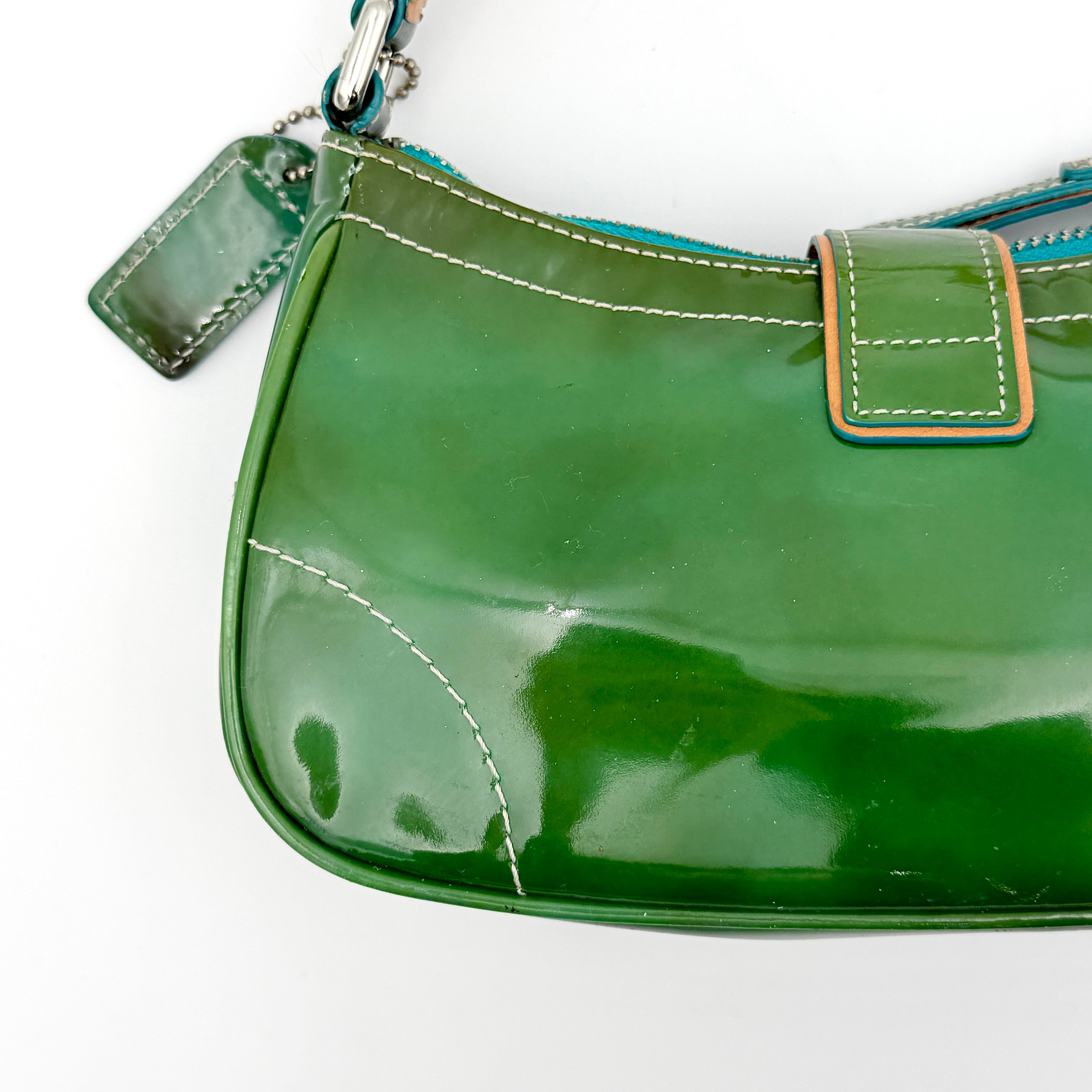 Coach Y2K Demi Soho shoulder bag in glossy green patent leather with silver hardware and natural leather strap.