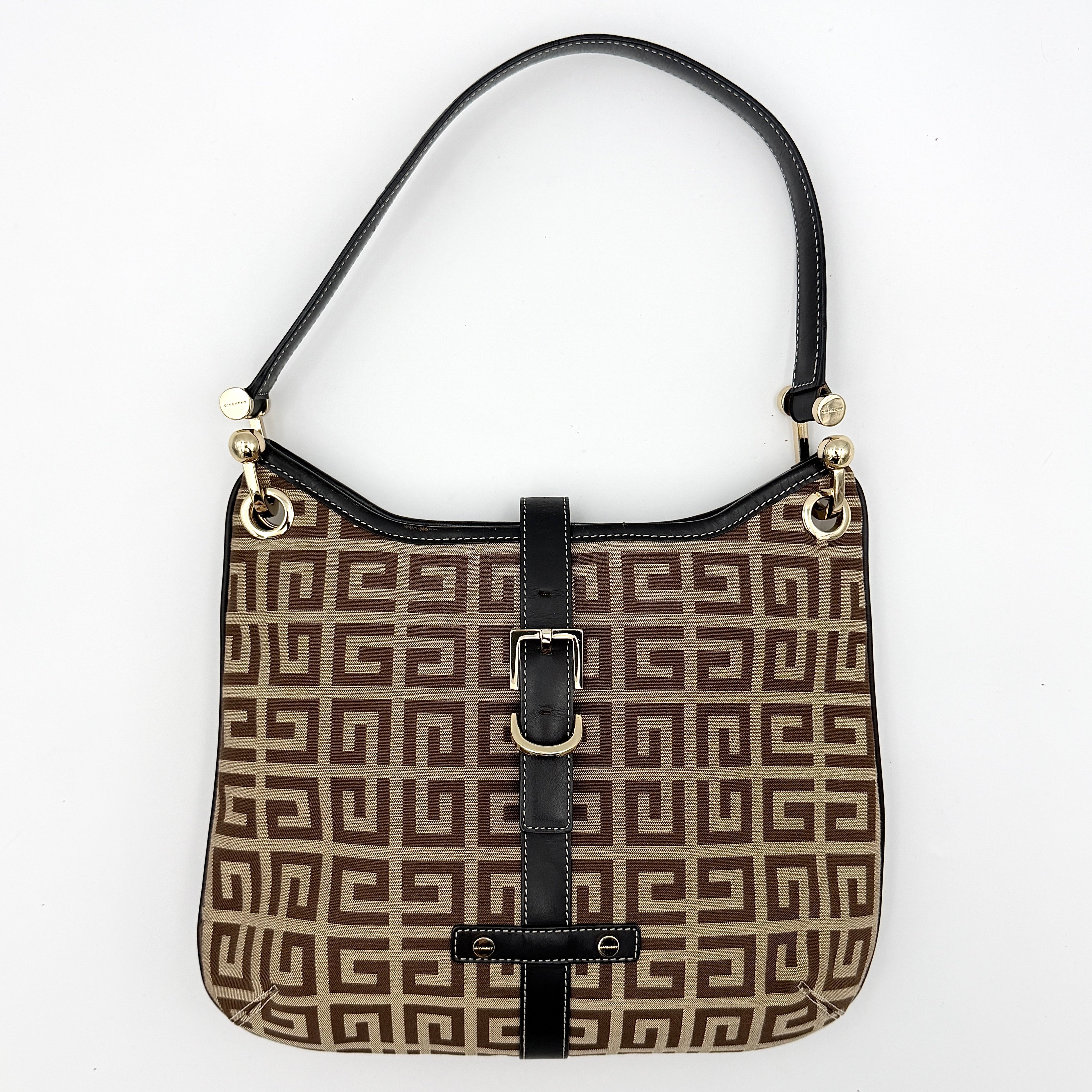 The Givenchy Monogram Hobo Shoulder Bag in brown canvas with black leather trim and gold hardware, displayed front-facing.
