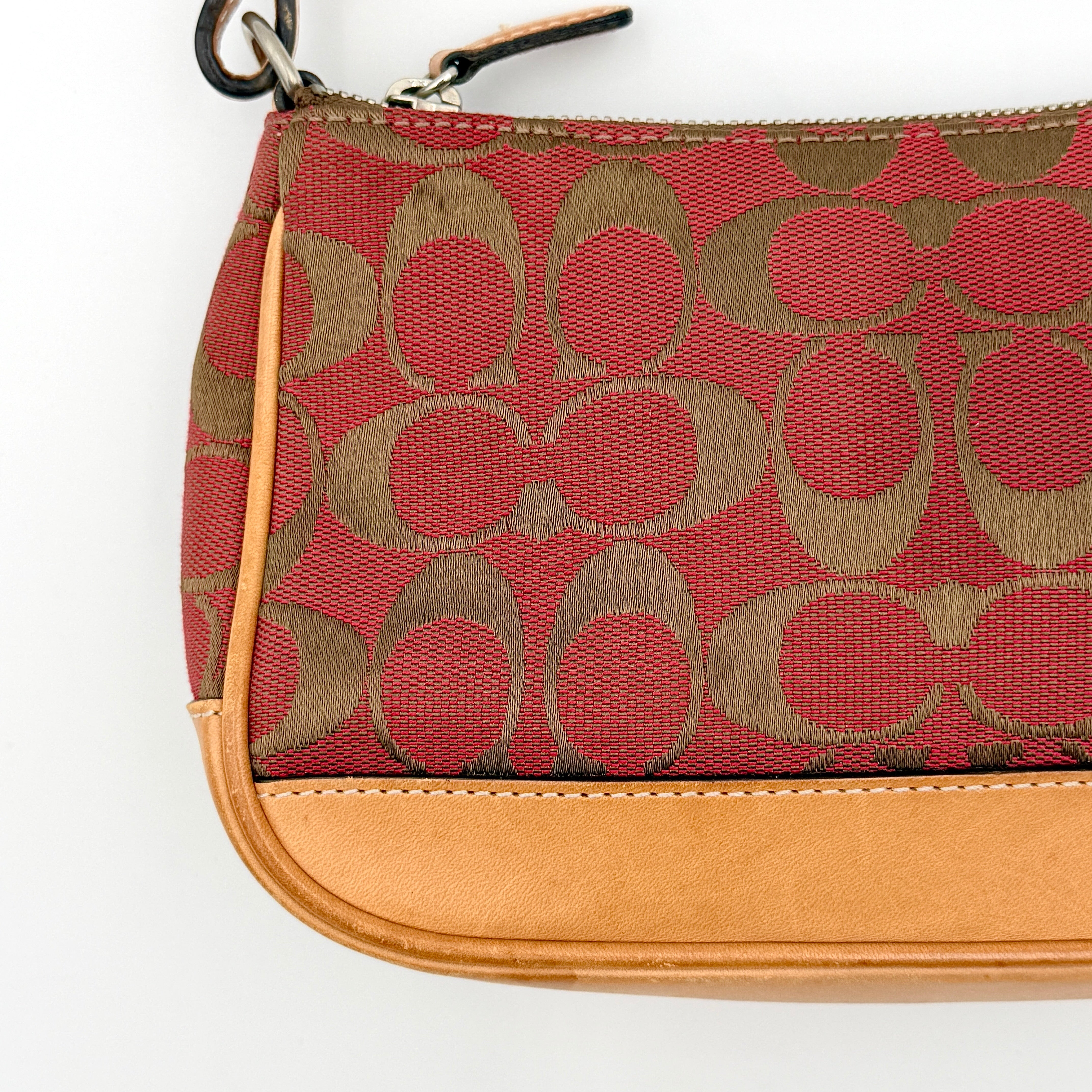 Coach Y2K Demi Shoulder Bag in red and tan signature monogram with leather trim, shown with leather strap and Coach tag.