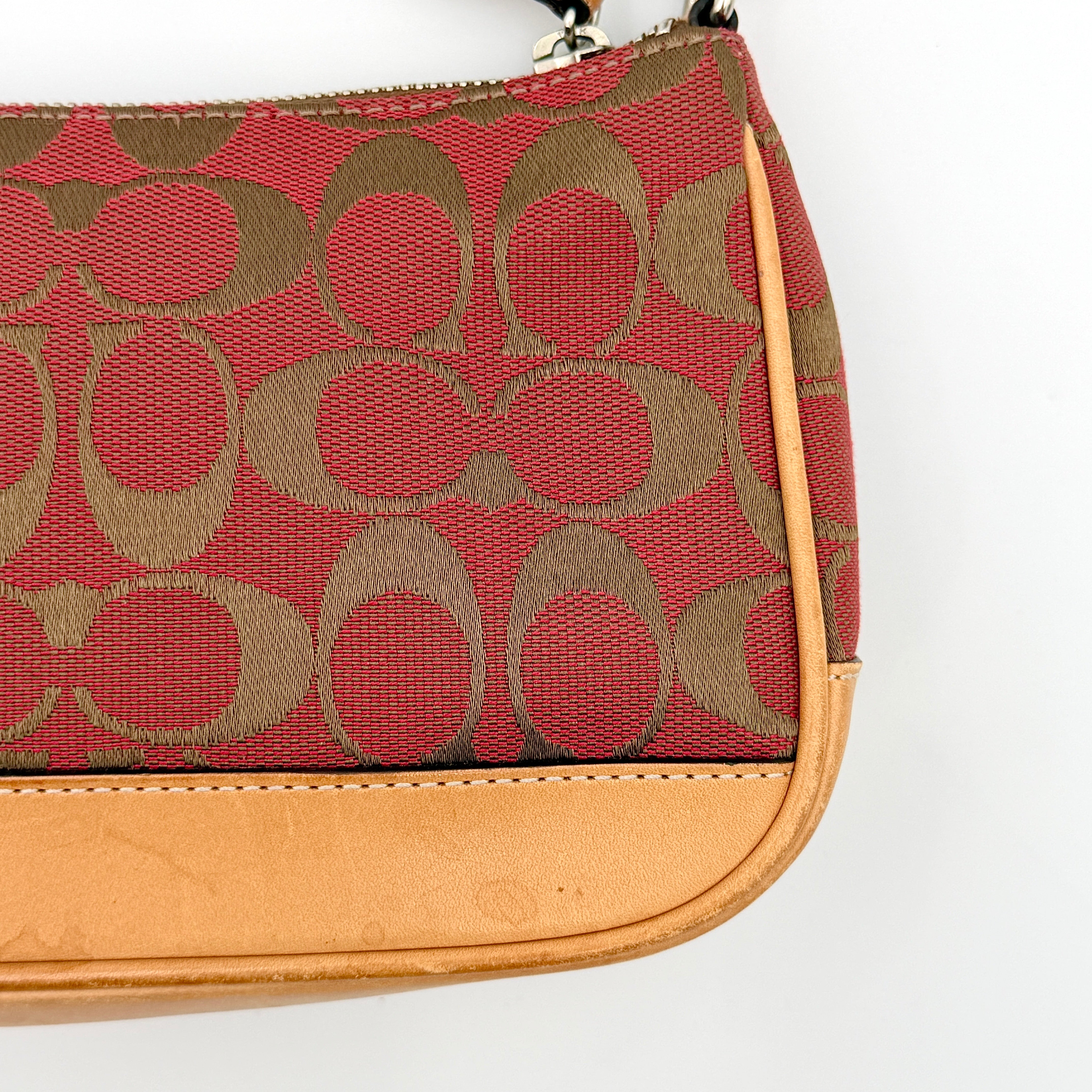 Coach Y2K Demi Shoulder Bag in red and tan signature monogram with leather trim, shown with leather strap and Coach tag.