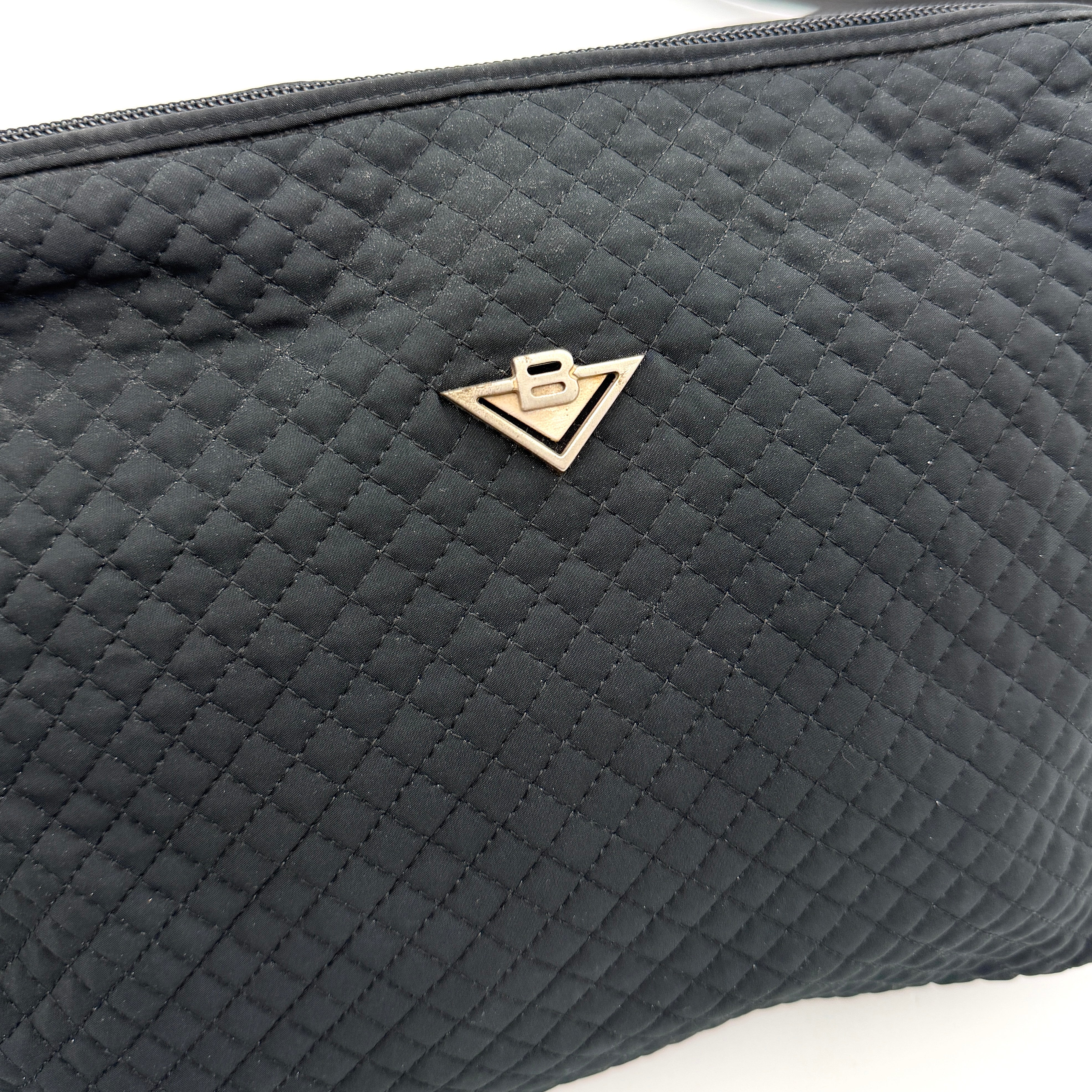 Bottega Veneta black quilted nylon crossbody bag with silver-tone logo hardware and leather strap.