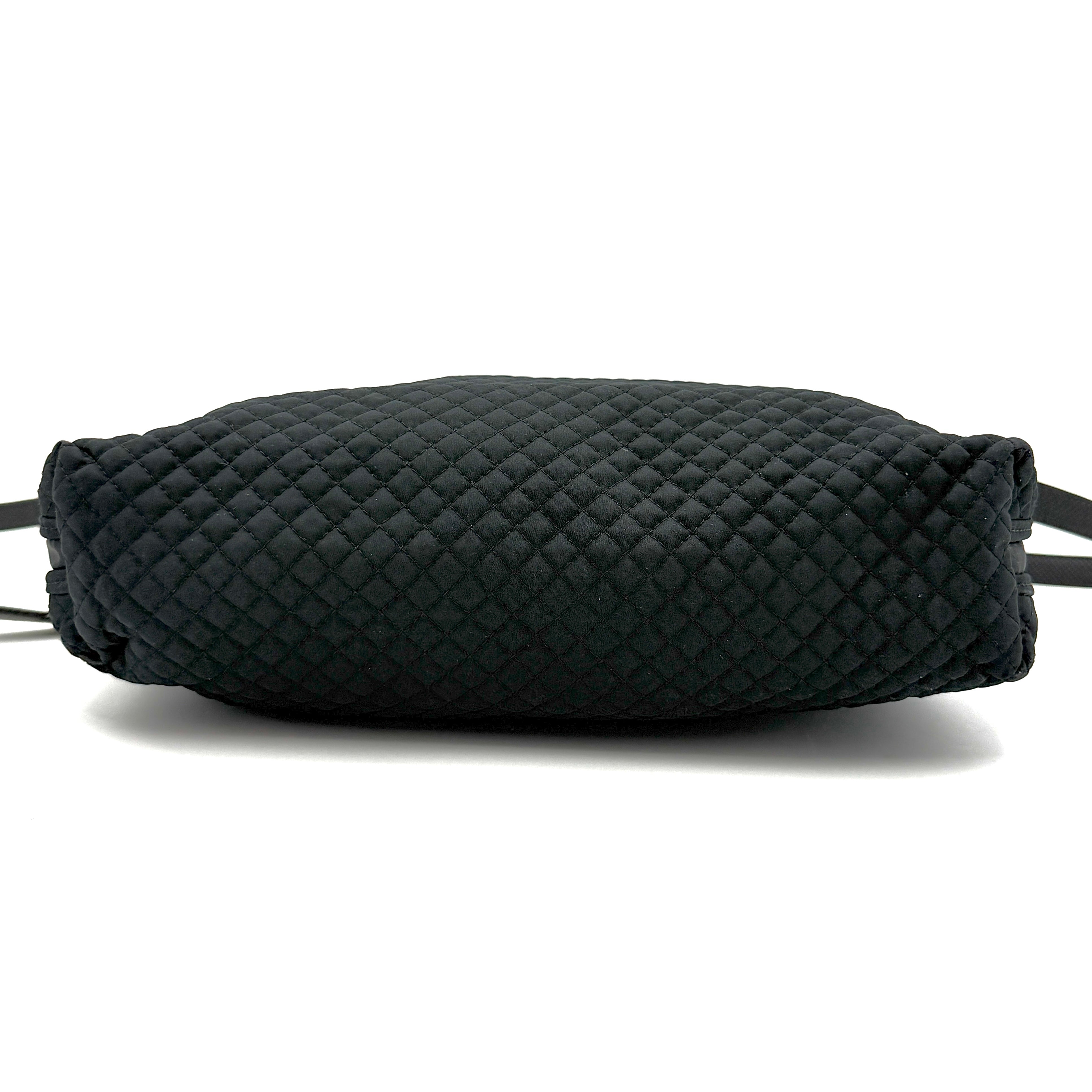 Bottega Veneta black quilted nylon crossbody bag with silver-tone logo hardware and leather strap.