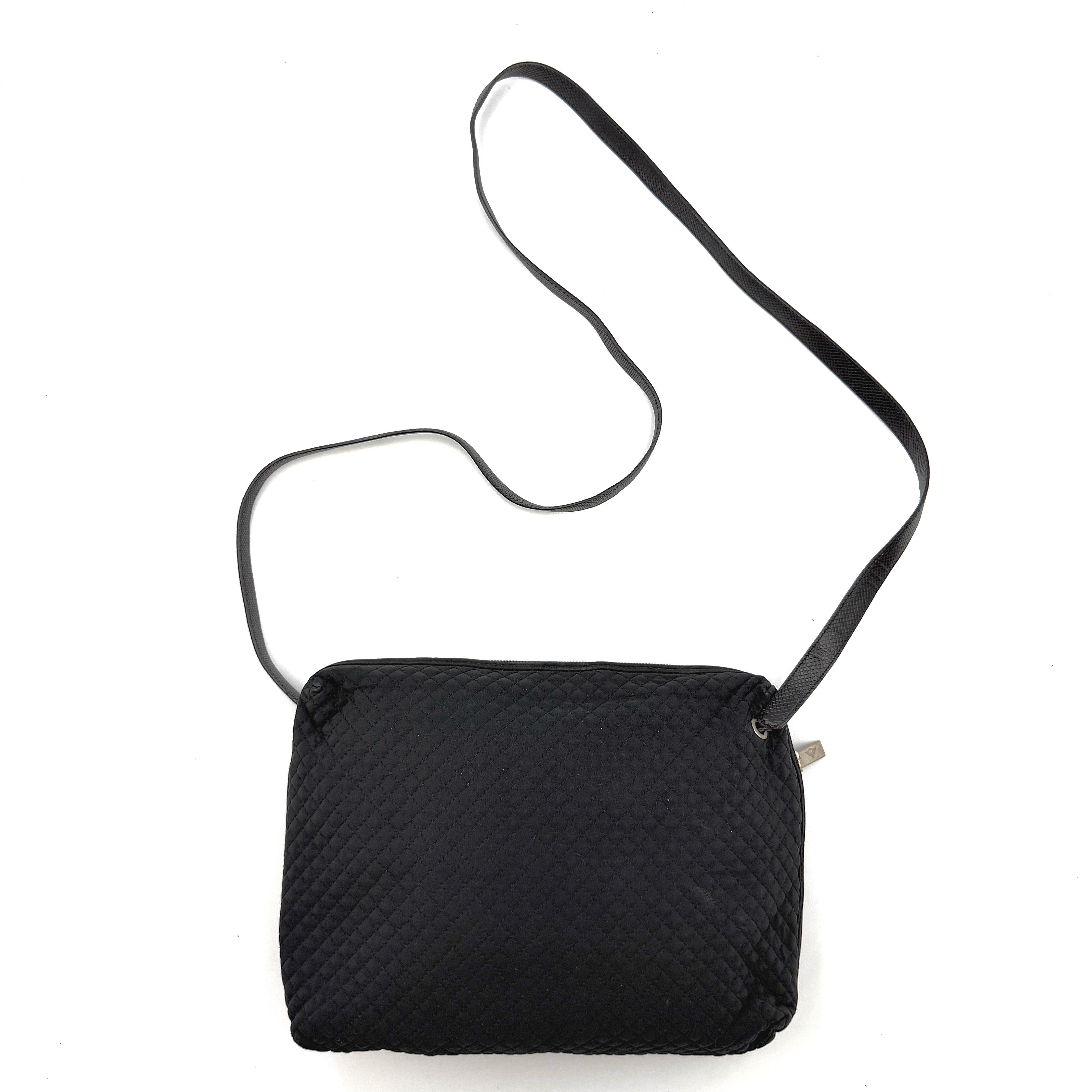 Bottega Veneta black quilted nylon crossbody bag with silver-tone logo hardware and leather strap.