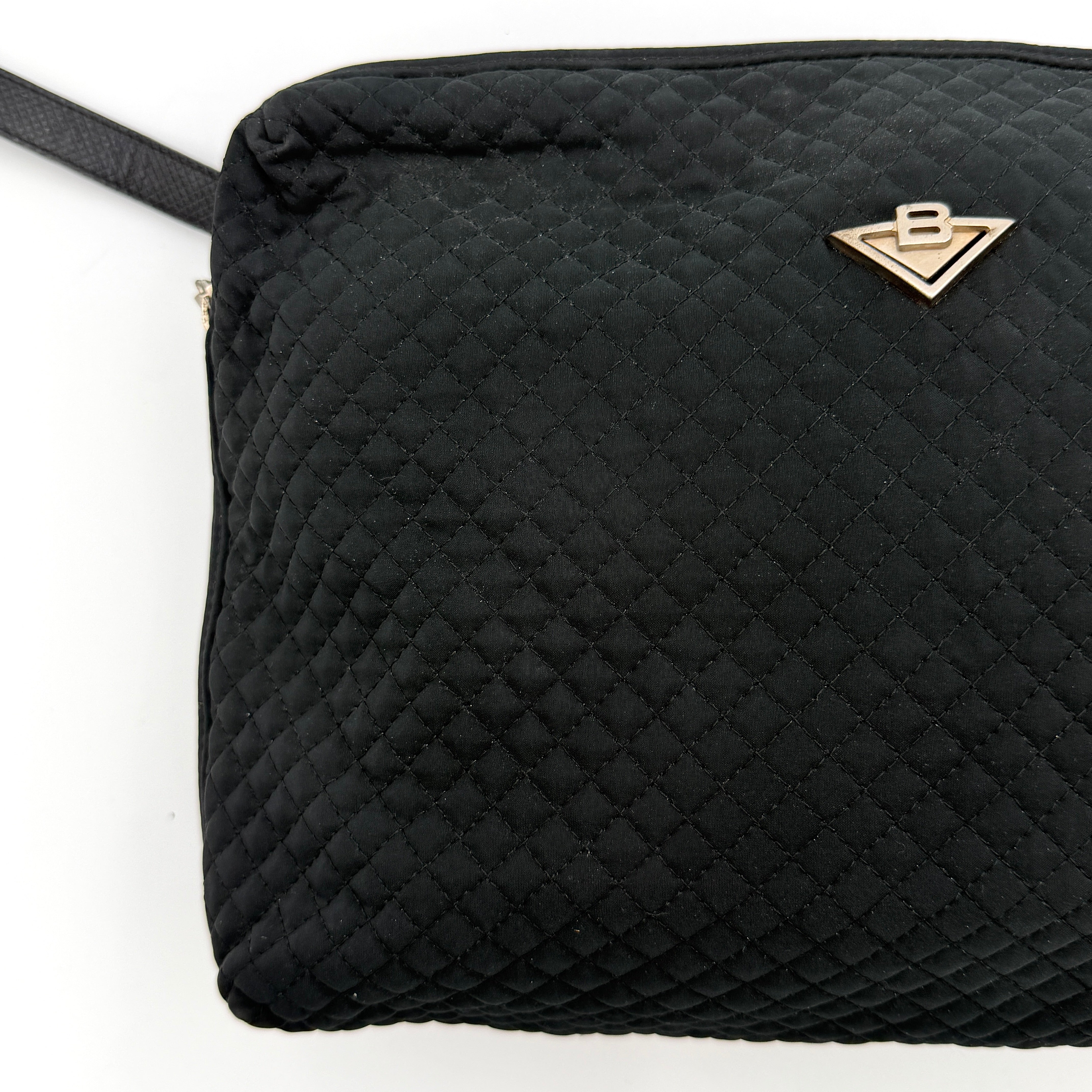 Bottega Veneta black quilted nylon crossbody bag with silver-tone logo hardware and leather strap.