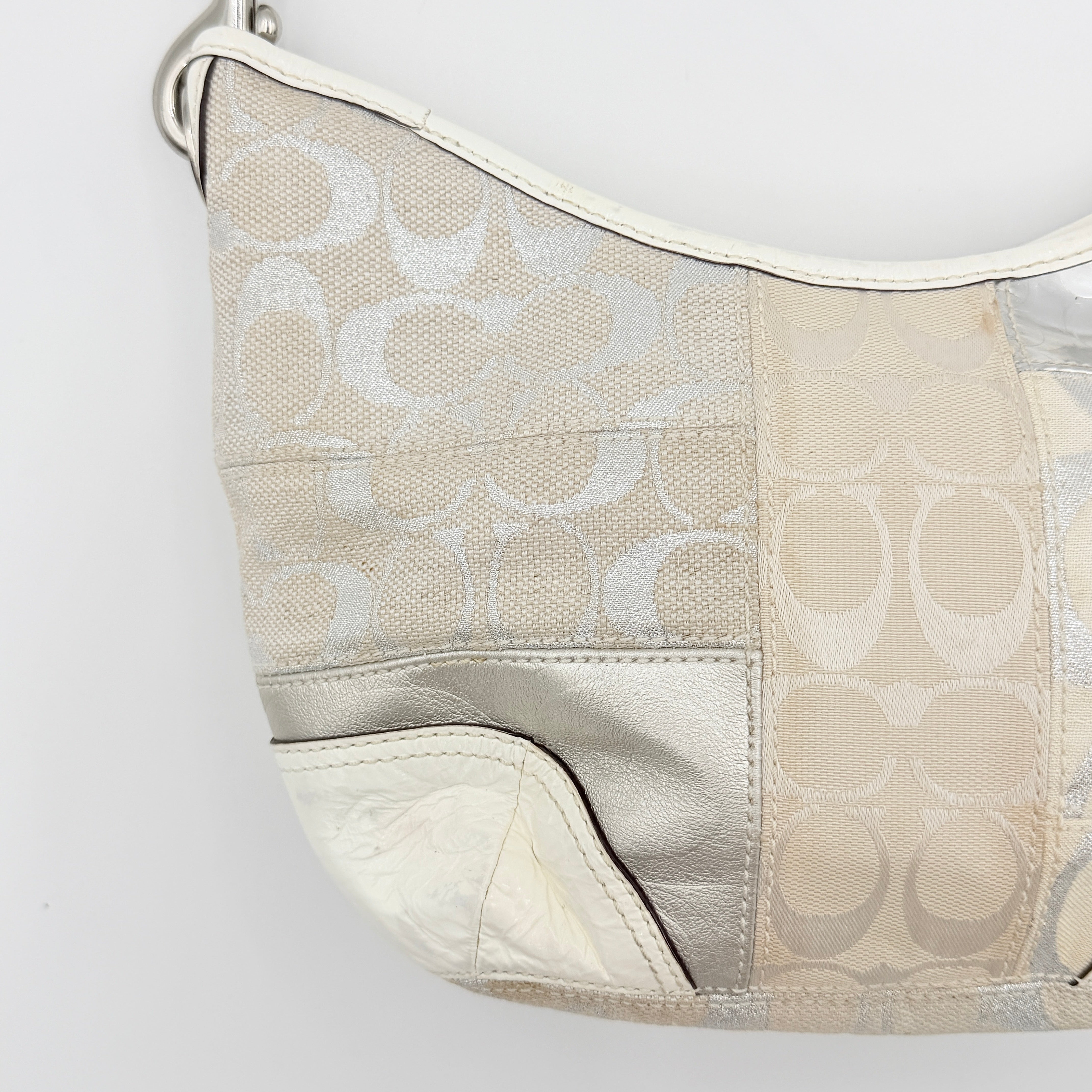 Coach Y2K Signature Patchwork Hobo Shoulder Bag in cream and silver jacquard with wide leather handle, shown on a white background.