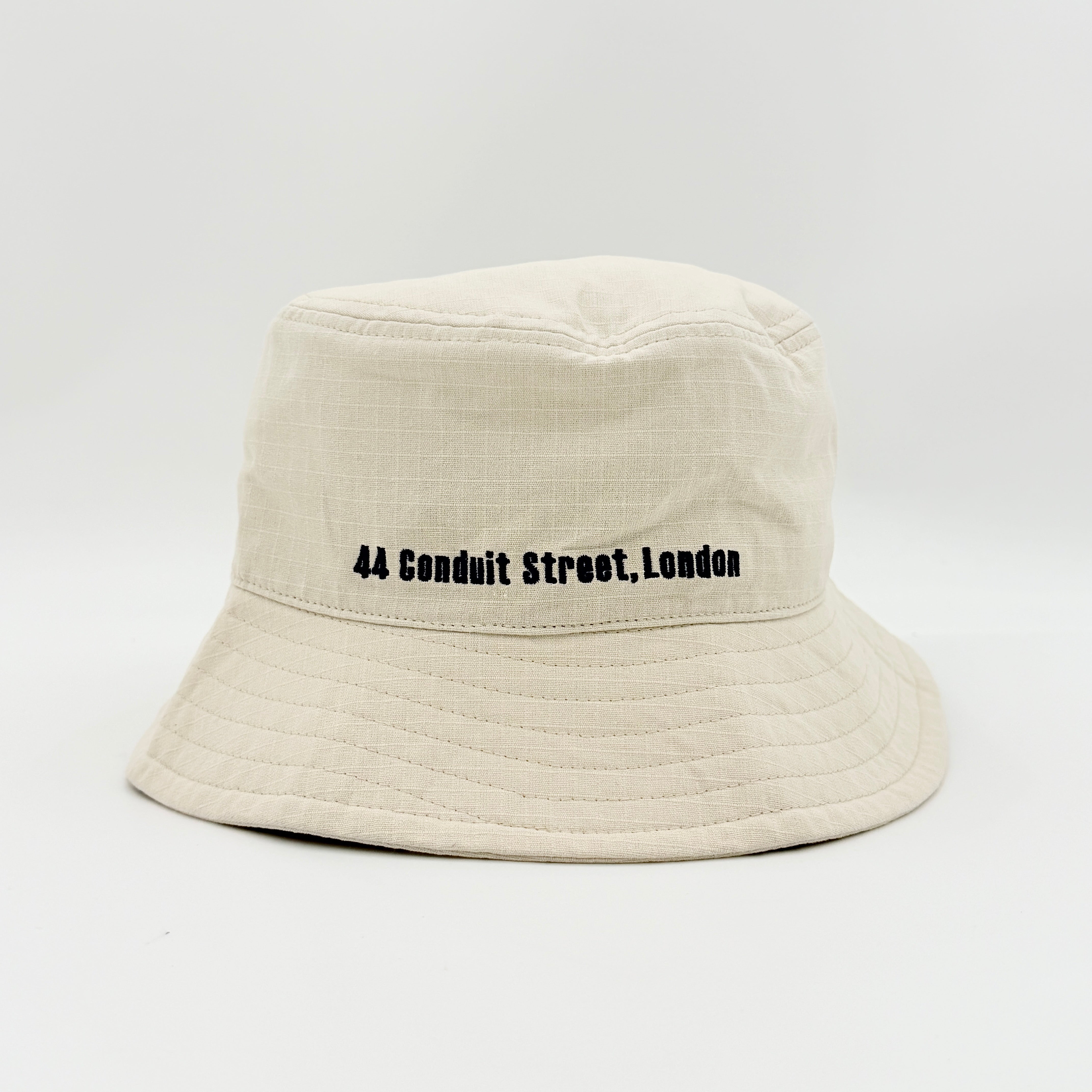 Vivienne Westwood Orb London bucket hat in cream cotton with black embroidery, shown from the front.