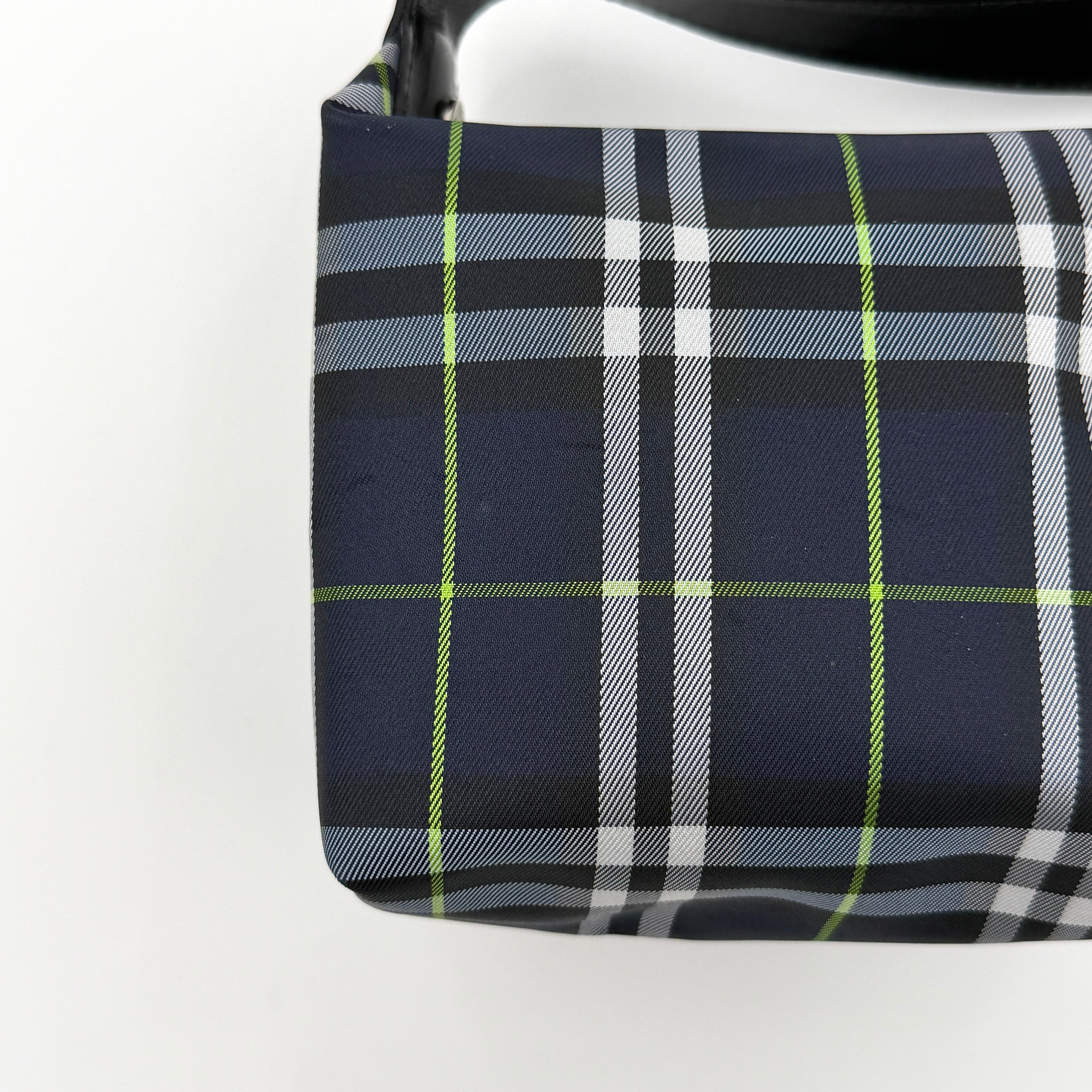 Burberry London mini handbag in navy Nova Check with black leather strap displayed against a clean white background.
