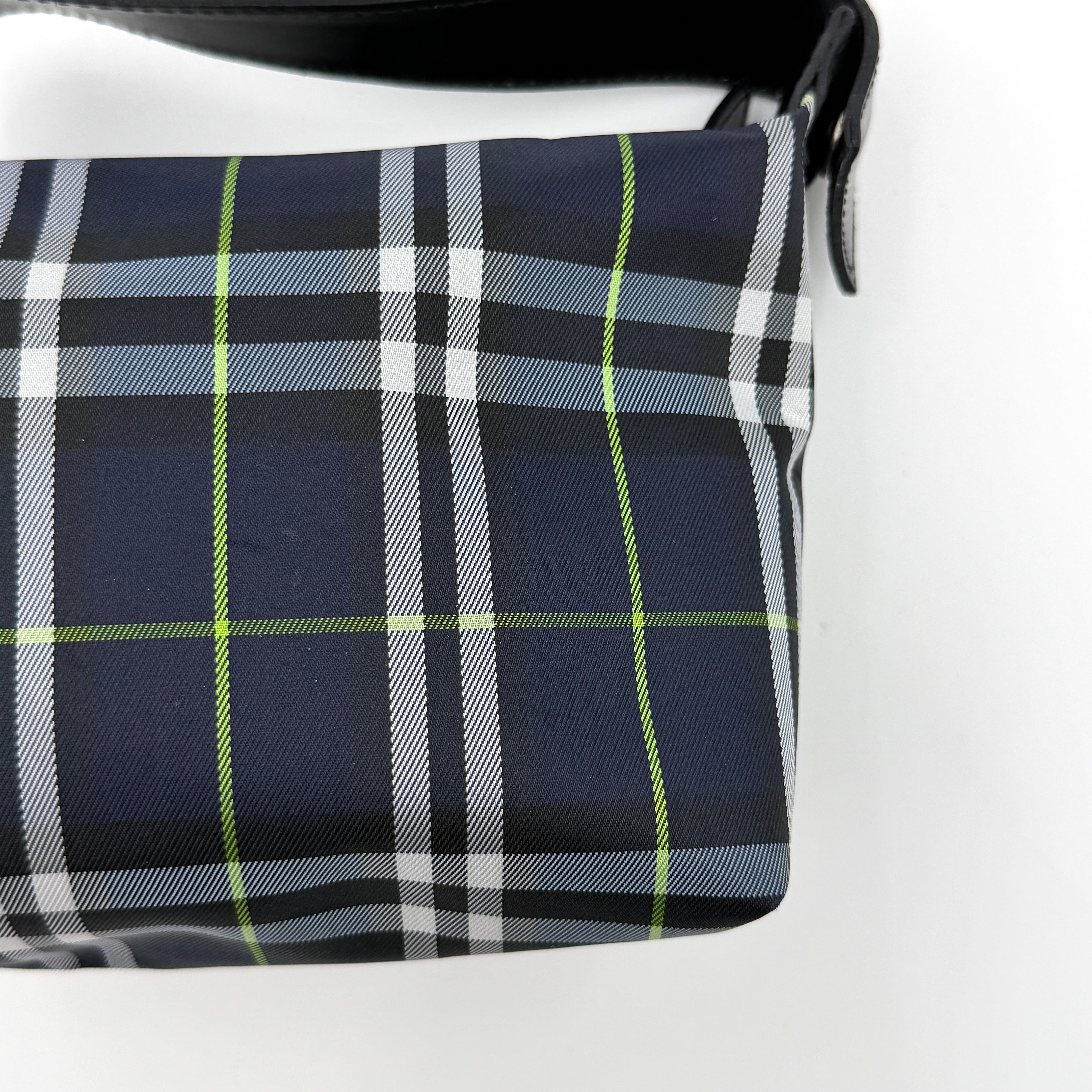 Burberry London mini handbag in navy Nova Check with black leather strap displayed against a clean white background.