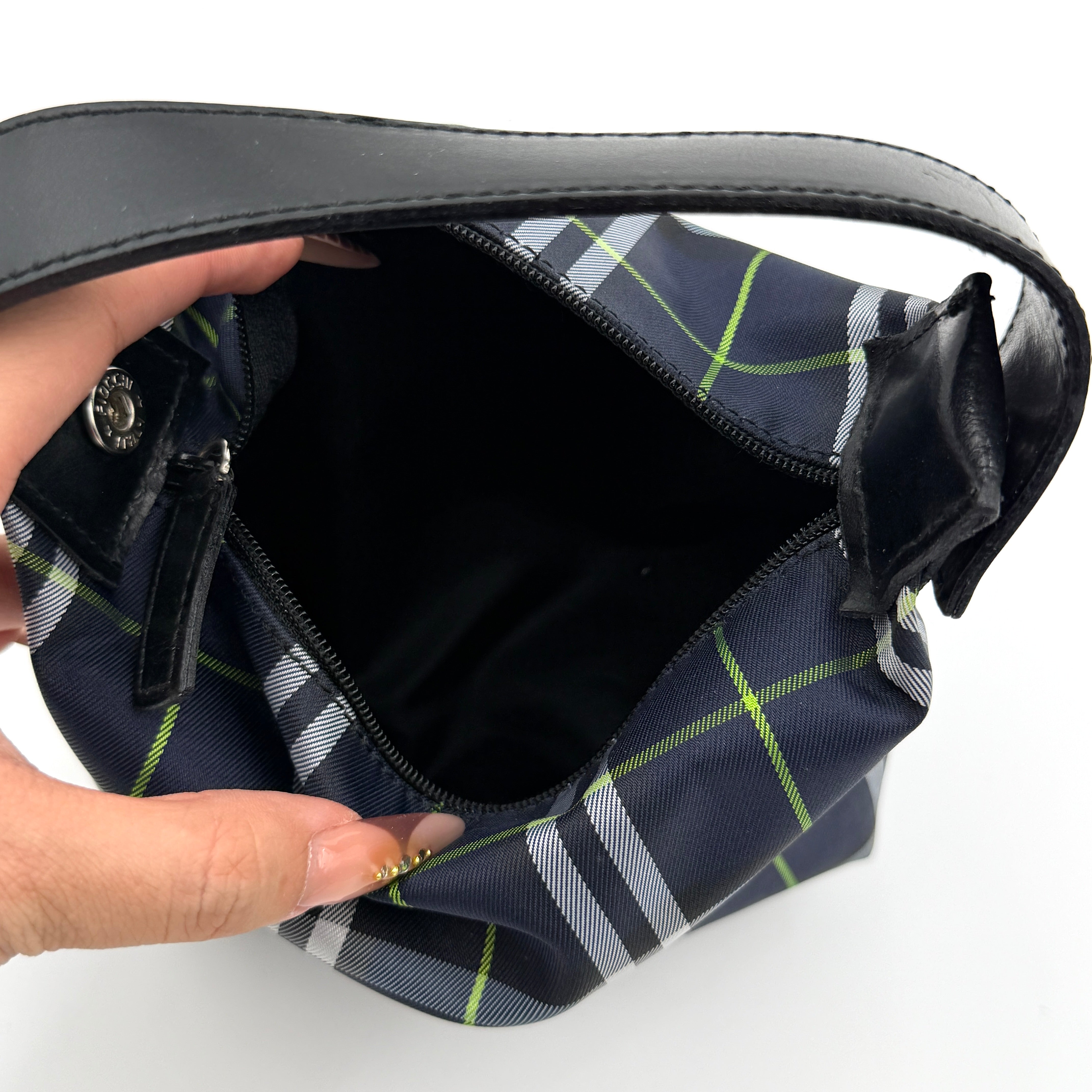 Burberry London mini handbag in navy Nova Check with black leather strap displayed against a clean white background.