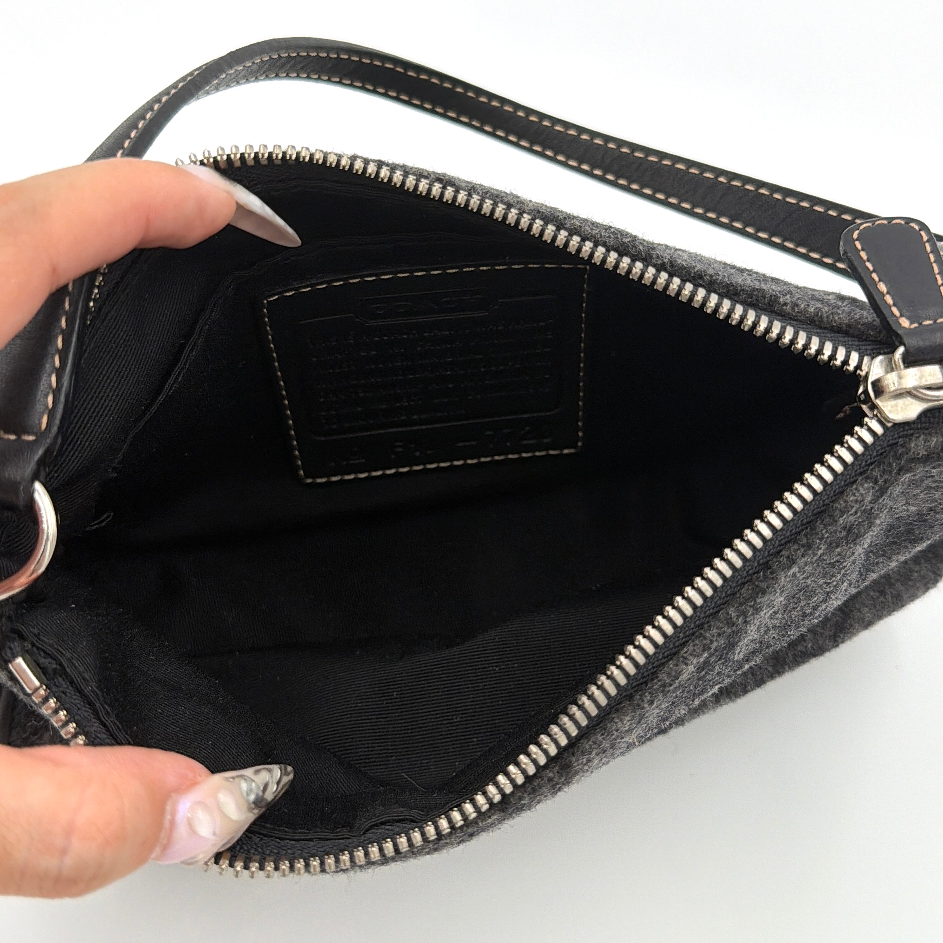 Coach Y2K Wool Demi Shoulder Bag in black and grey with monogram pattern, leather trim, and silver-tone details.