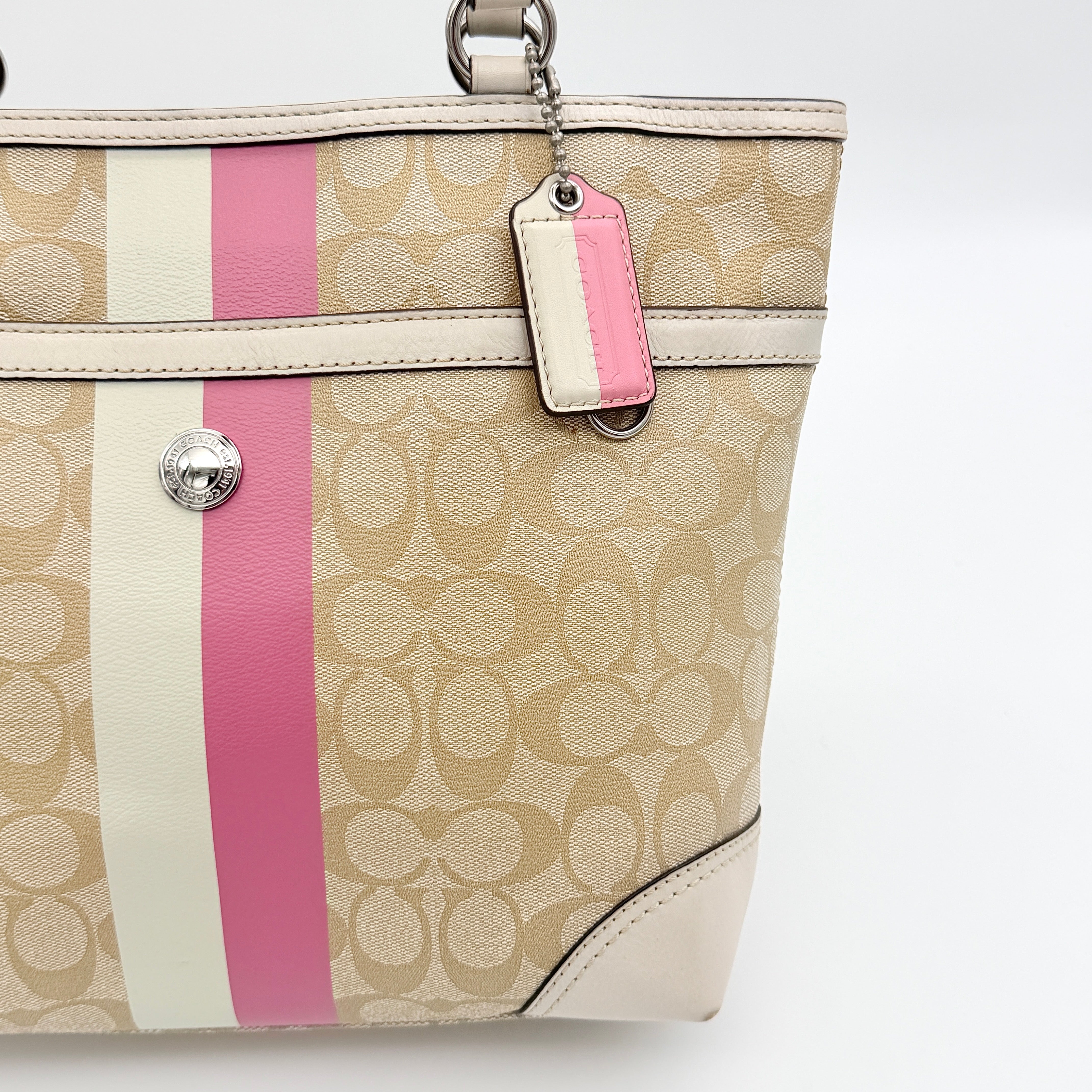 Coach Signature Chelsea Heritage Stripe Tote in beige with pink and cream accents, finished with dual-colour hangtag and leather trim.
