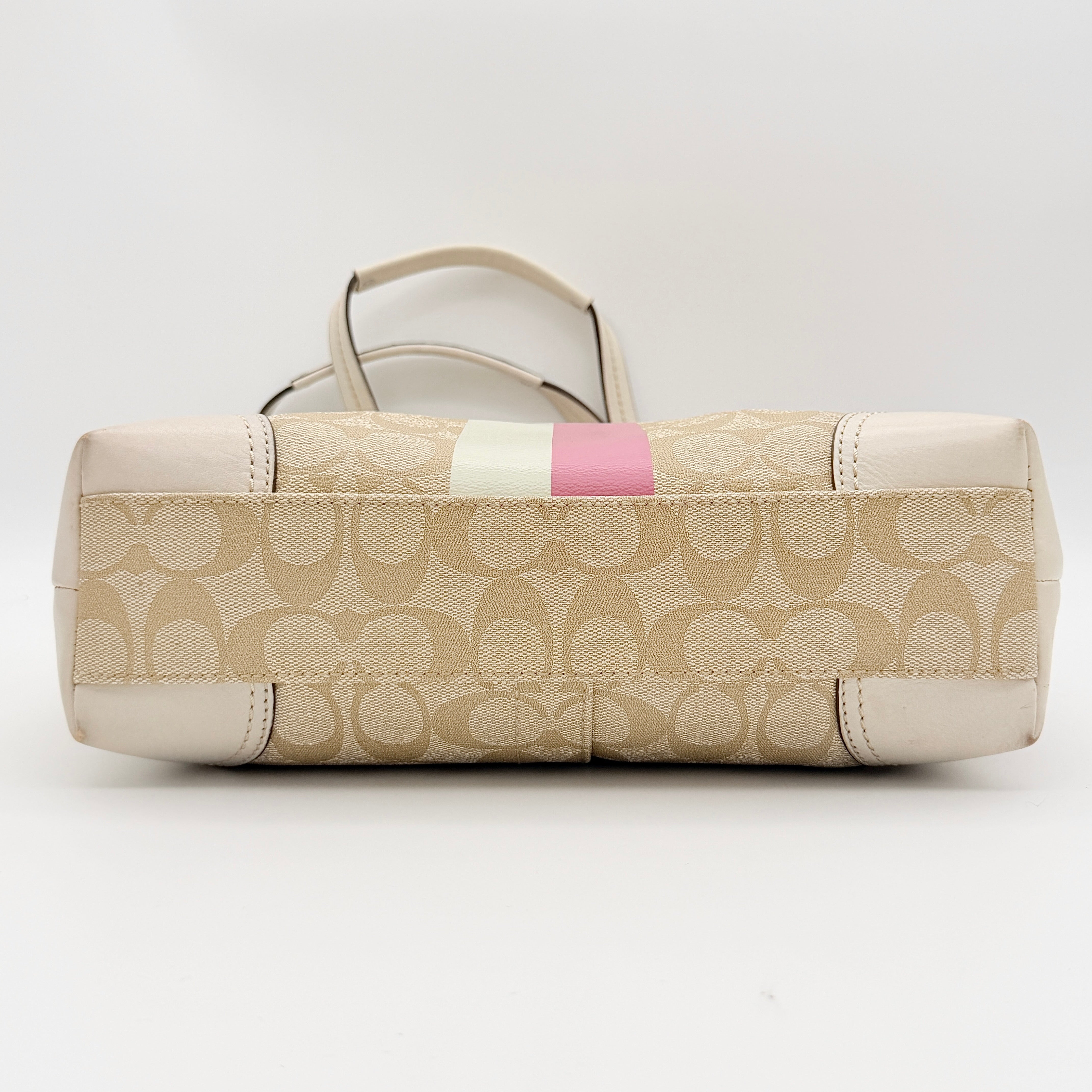 Coach Signature Chelsea Heritage Stripe Tote in beige with pink and cream accents, finished with dual-colour hangtag and leather trim.