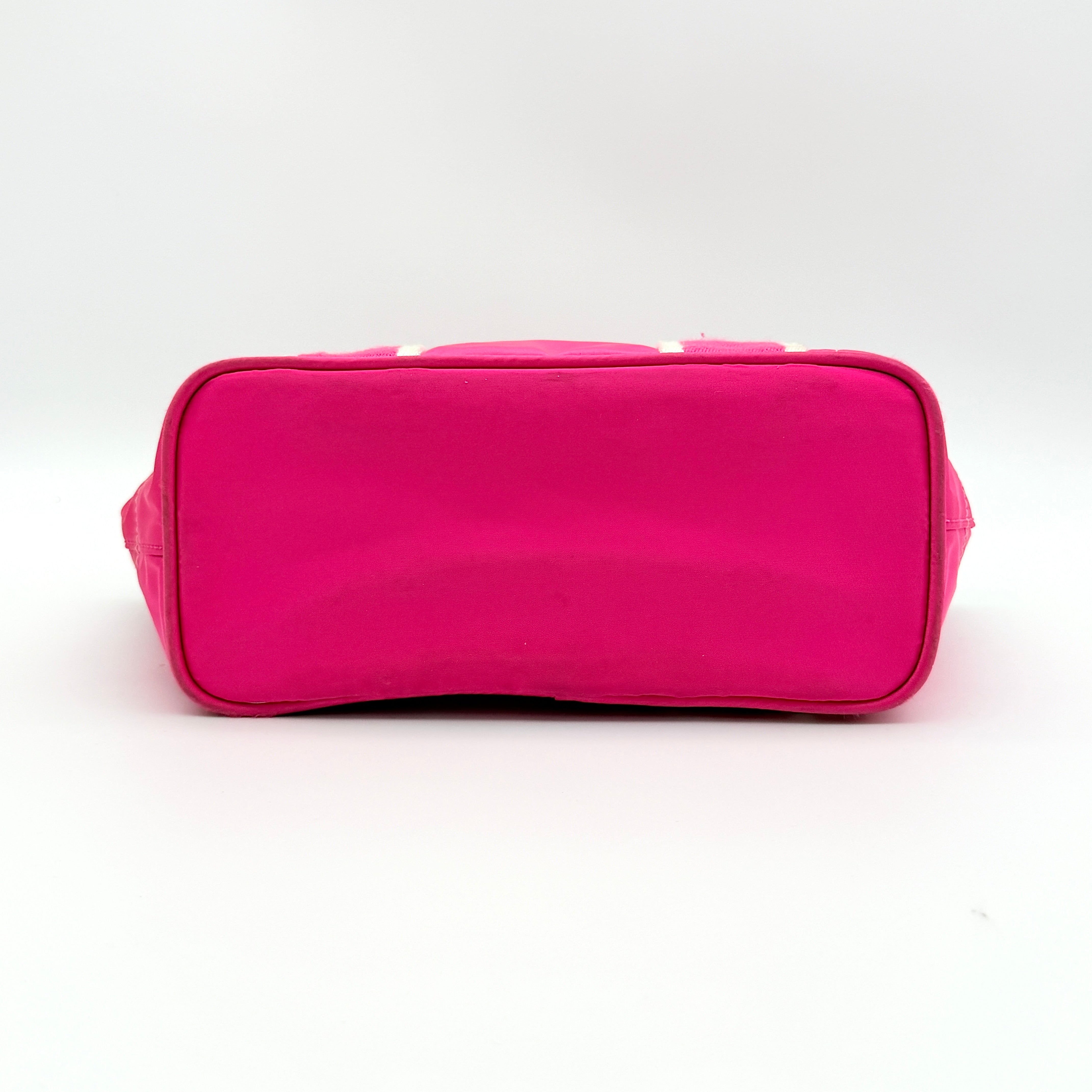Coach Hampton Mini Tote Bag in hot pink nylon with canvas straps, leather trim, and ladybug charm.