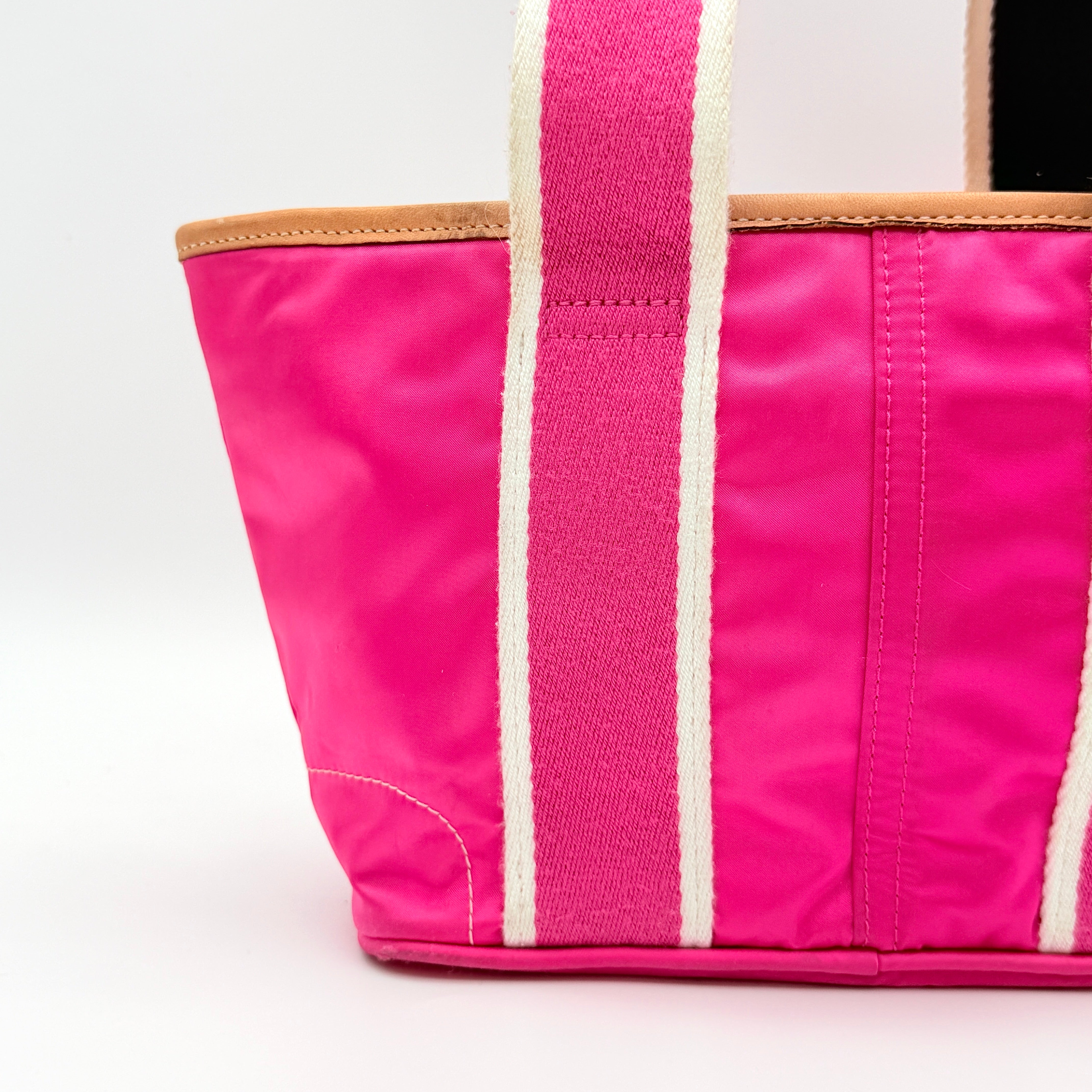 Coach Hampton Mini Tote Bag in hot pink nylon with canvas straps, leather trim, and ladybug charm.