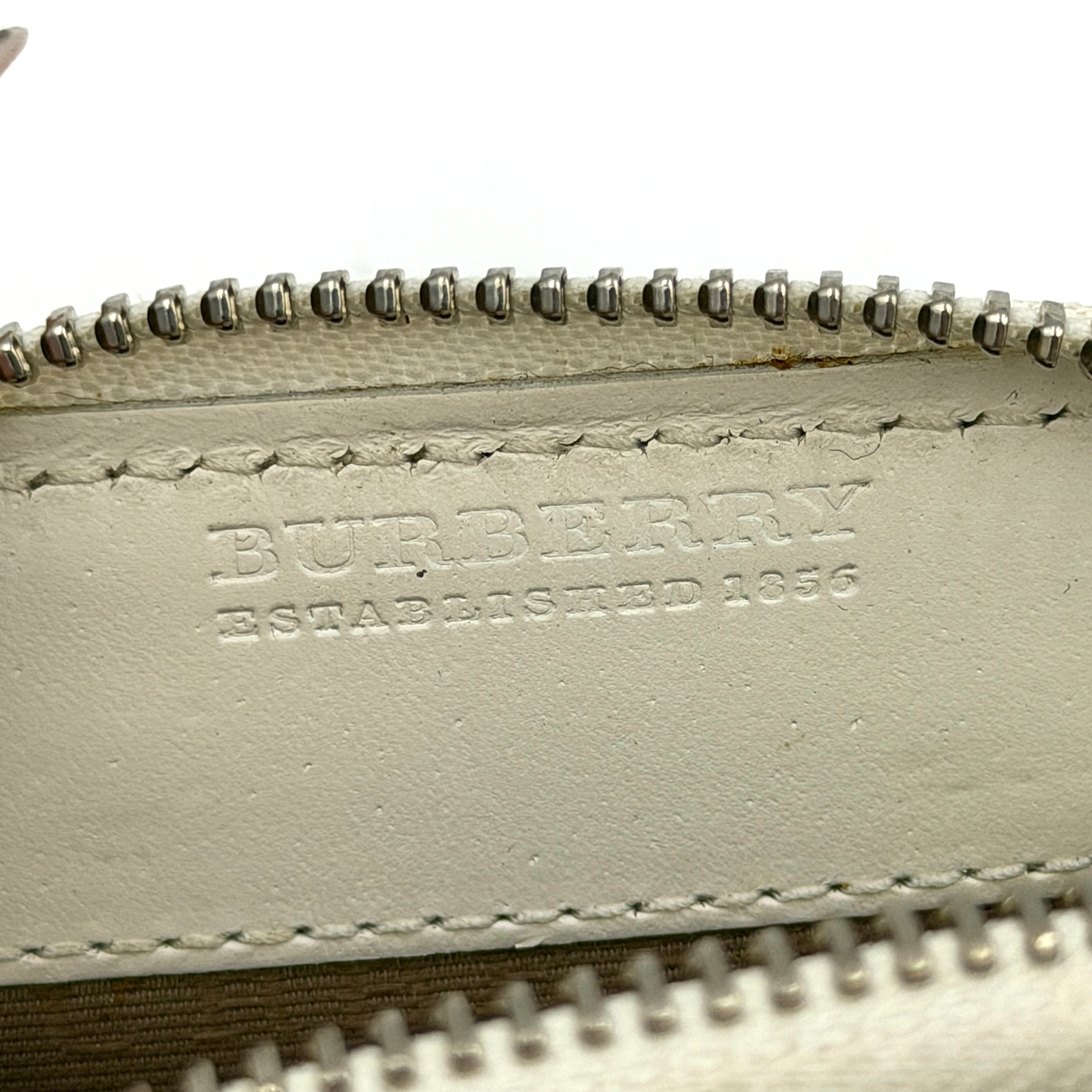 Burberry Heart Nova Check coin case in beige canvas with ivory leather trim and heart charms on the zipper pull.