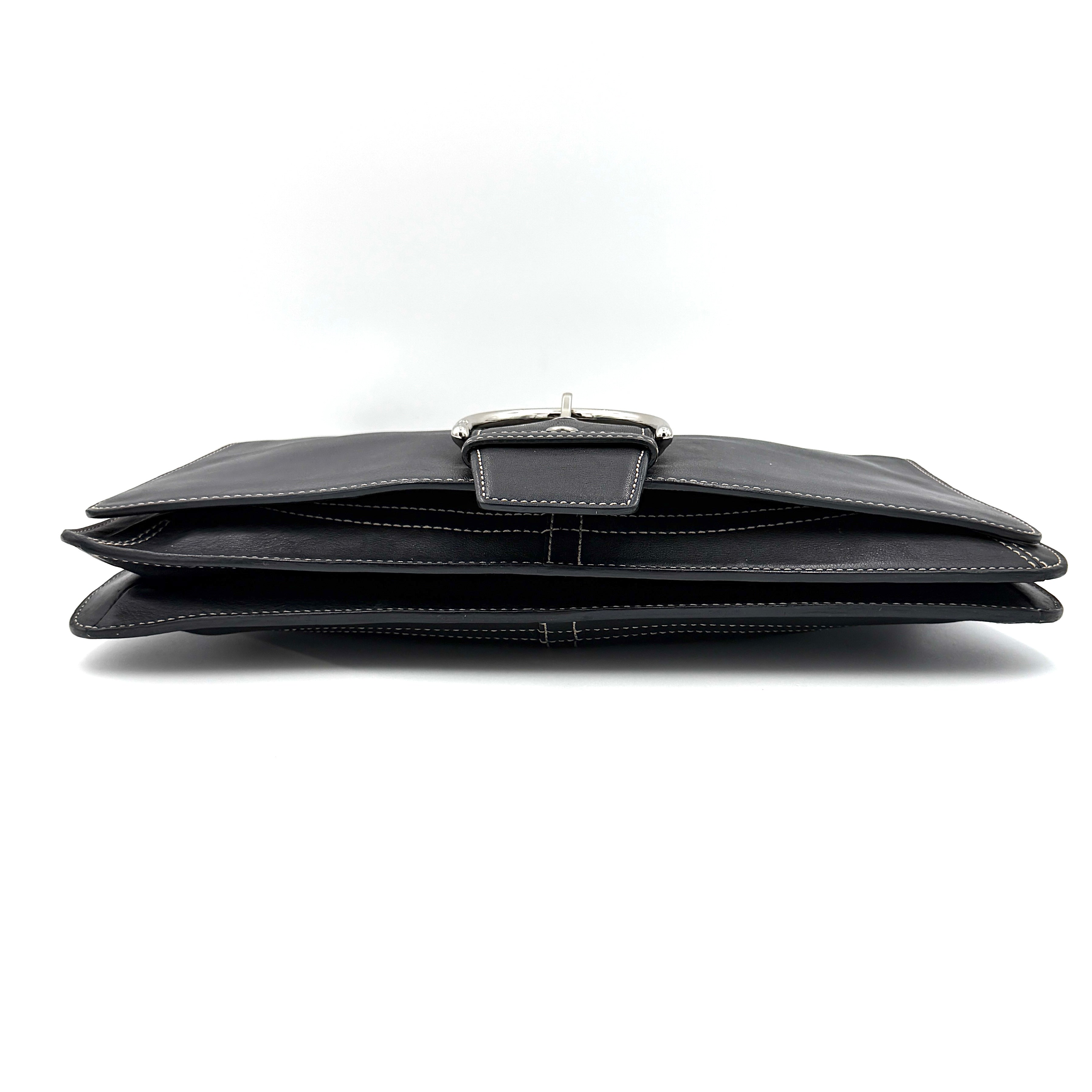 Coach Y2K Soho Buckle Shoulder Bag in smooth black leather with contrast stitching and a bold silver horseshoe buckle.