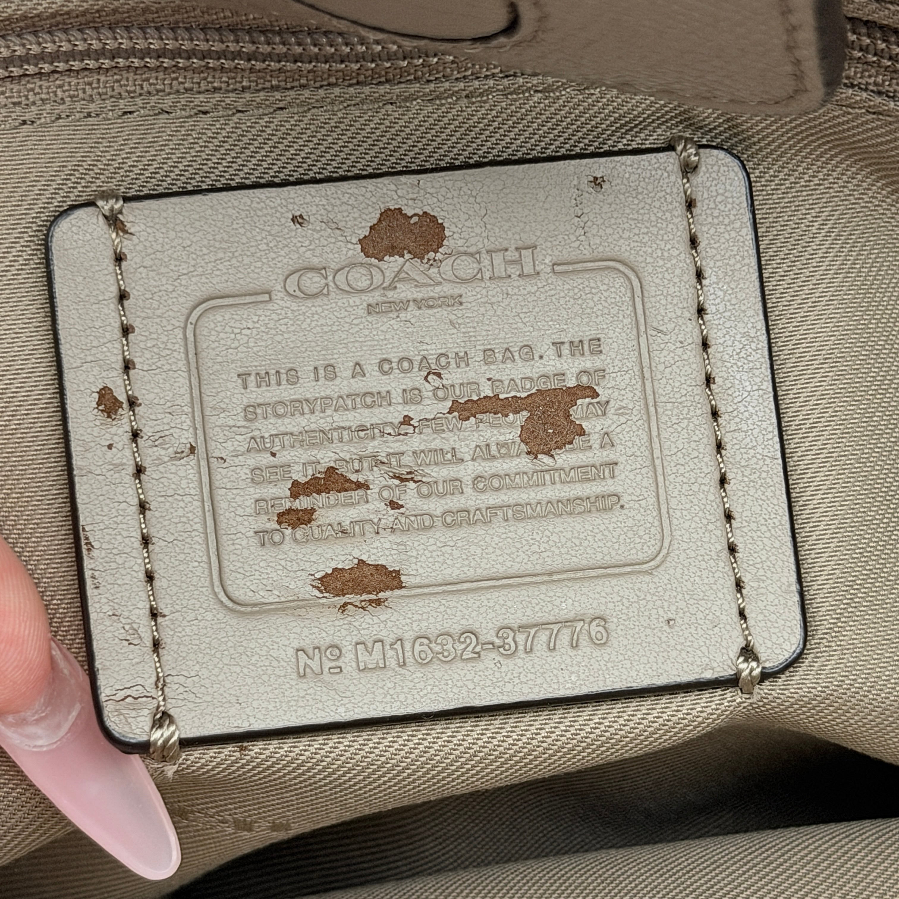 Coach Turnlock Carryall Shoulder Bag in light brown grained leather with silver hardware and double shoulder straps.