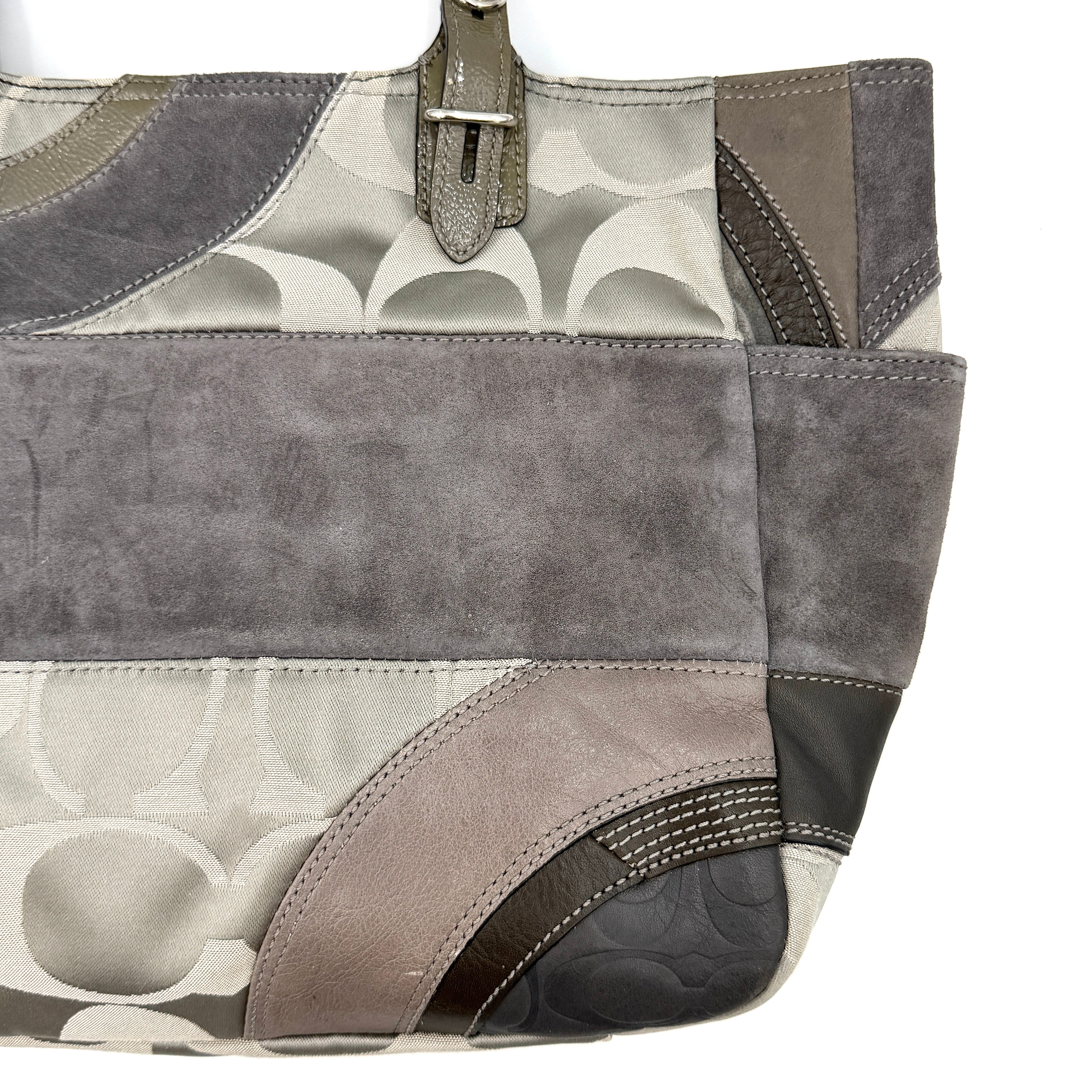 Coach Y2K patchwork tote in grey tones with jacquard, suede, and ocelot-print panels, shown with double handles and signature tag.