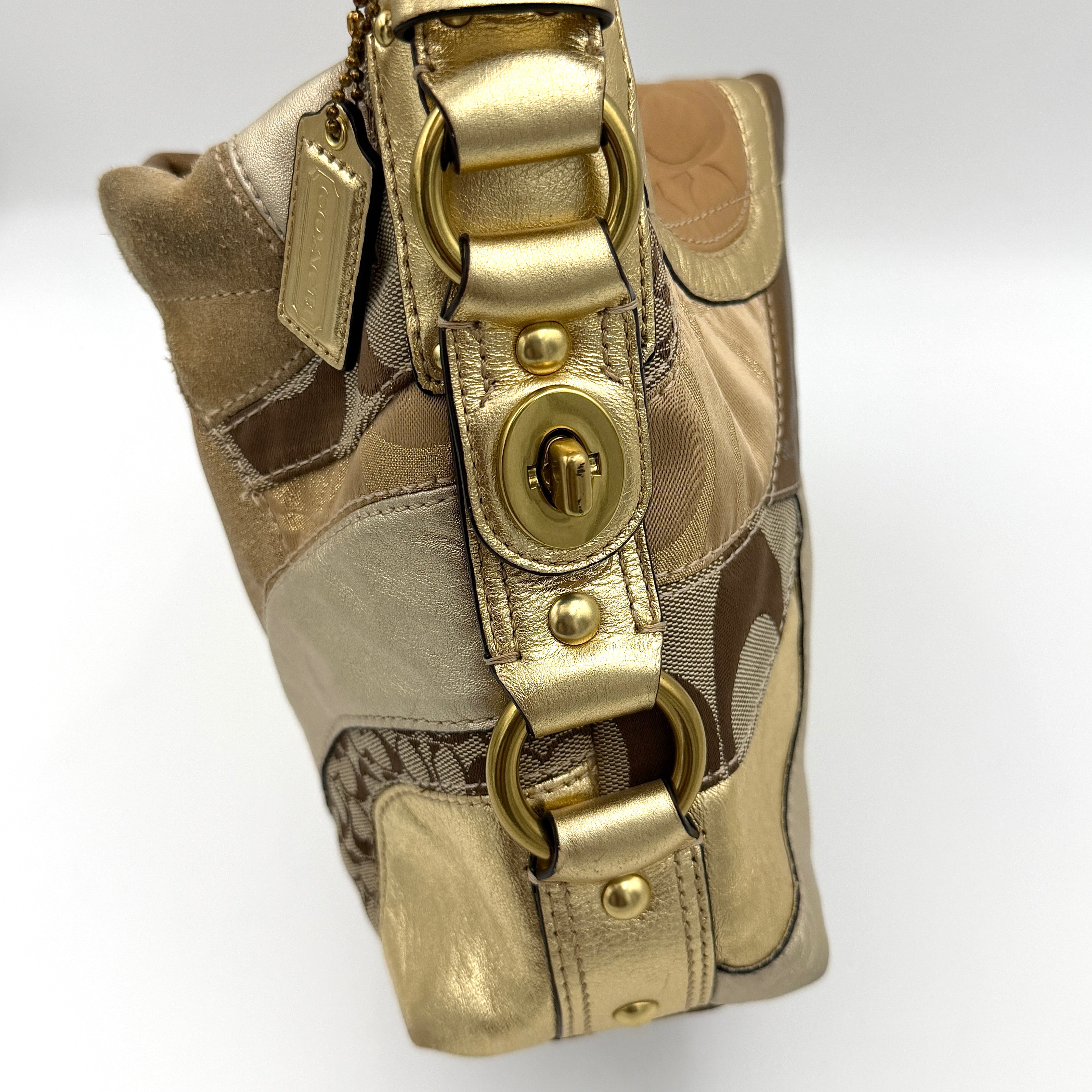 Coach Carly Patchwork Shoulder Bag in a blend of metallic gold, beige, and signature jacquard with gold hardware and a curved chain-link strap.