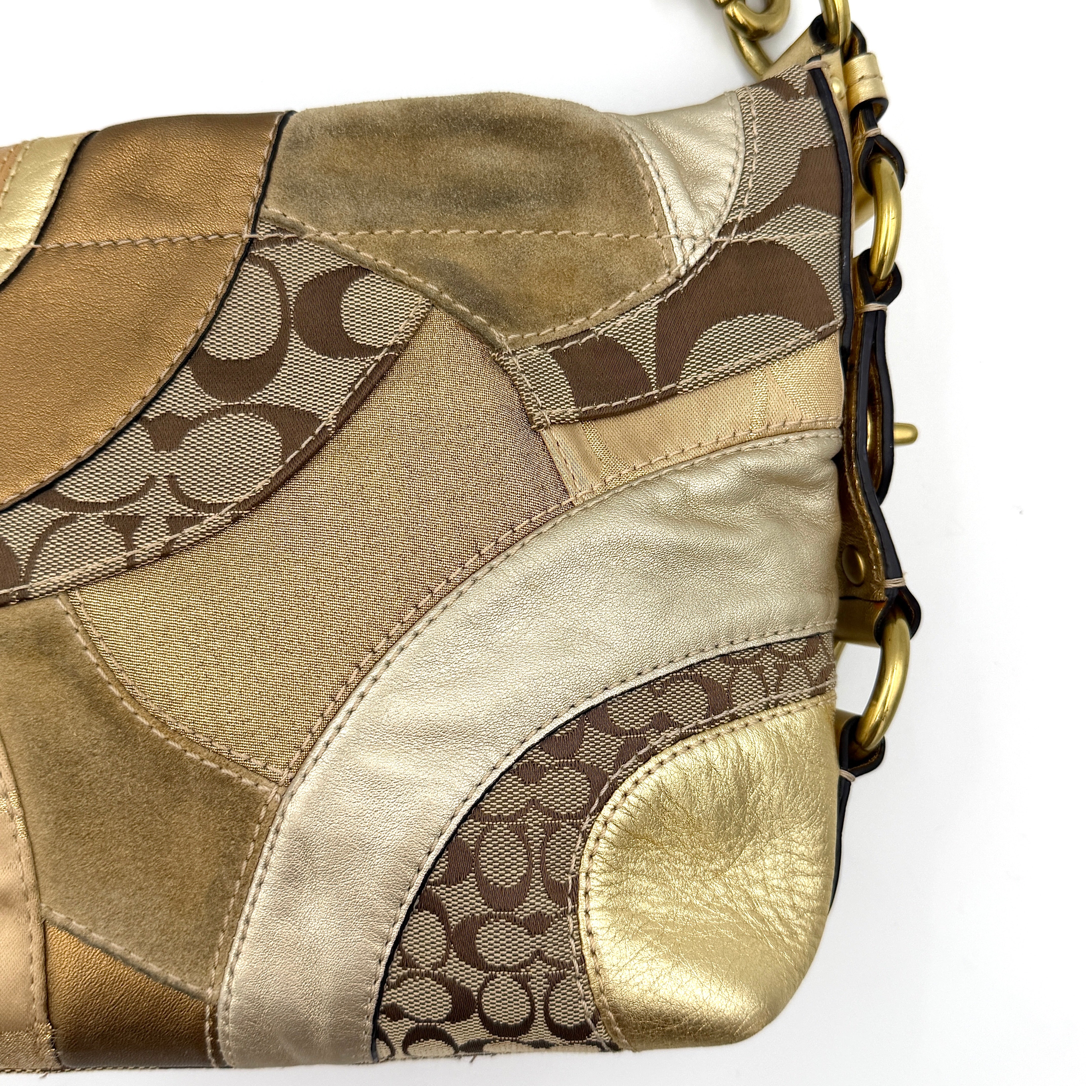 Coach Carly Patchwork Shoulder Bag in a blend of metallic gold, beige, and signature jacquard with gold hardware and a curved chain-link strap.