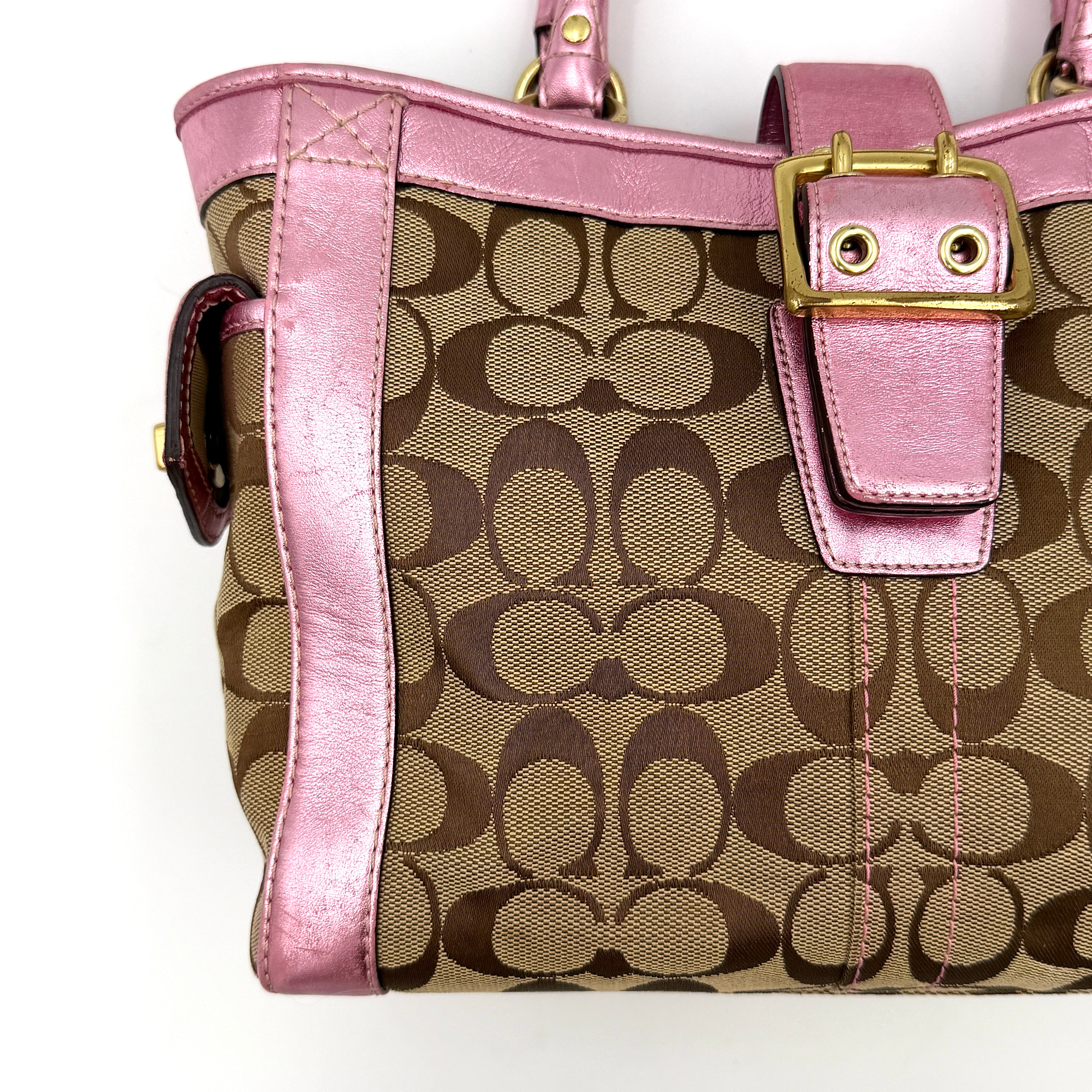 Coach Soho Buckle Tote featuring baby pink metallic leather trim and beige signature jacquard canvas with gold-tone hardware.