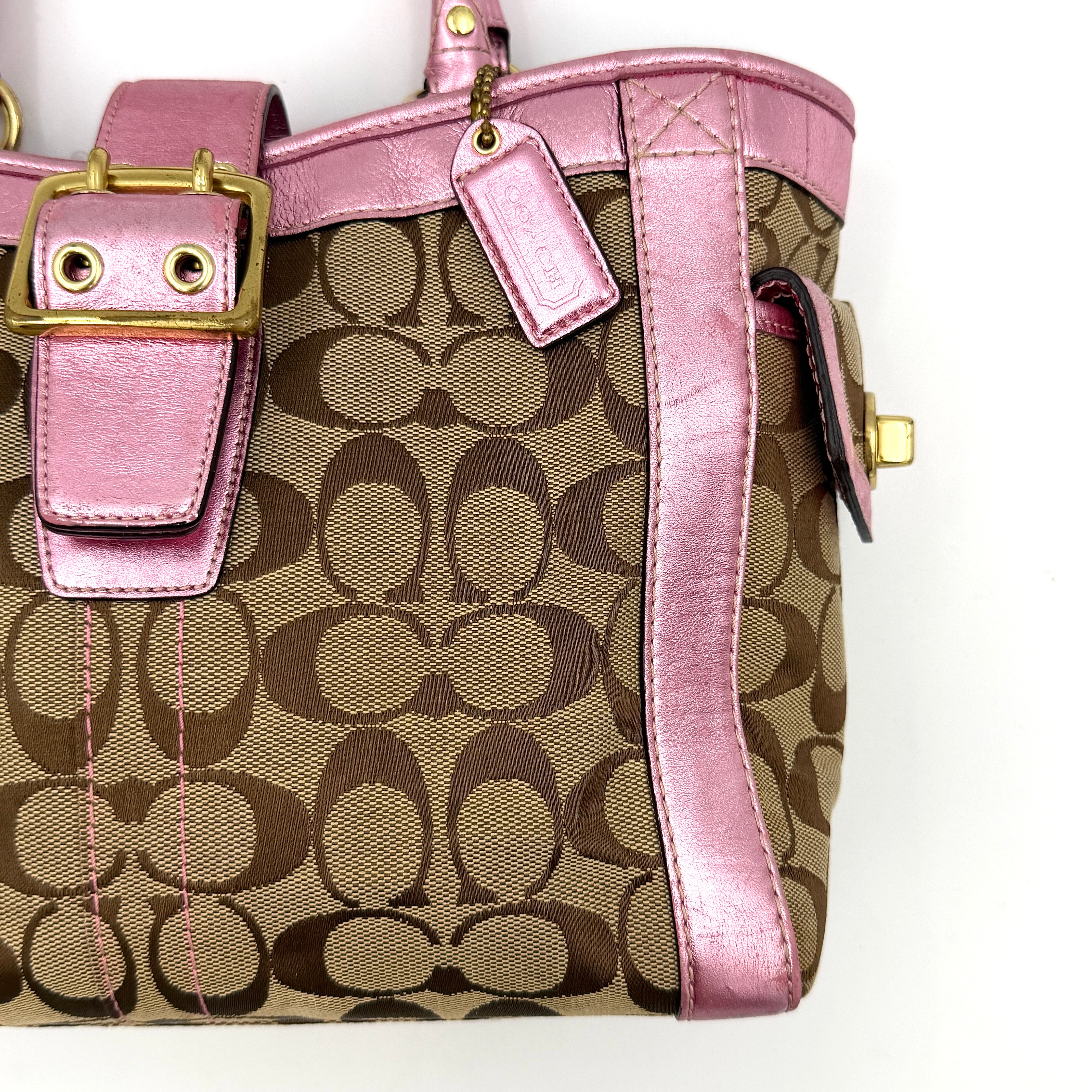 Coach Soho Buckle Tote featuring baby pink metallic leather trim and beige signature jacquard canvas with gold-tone hardware.