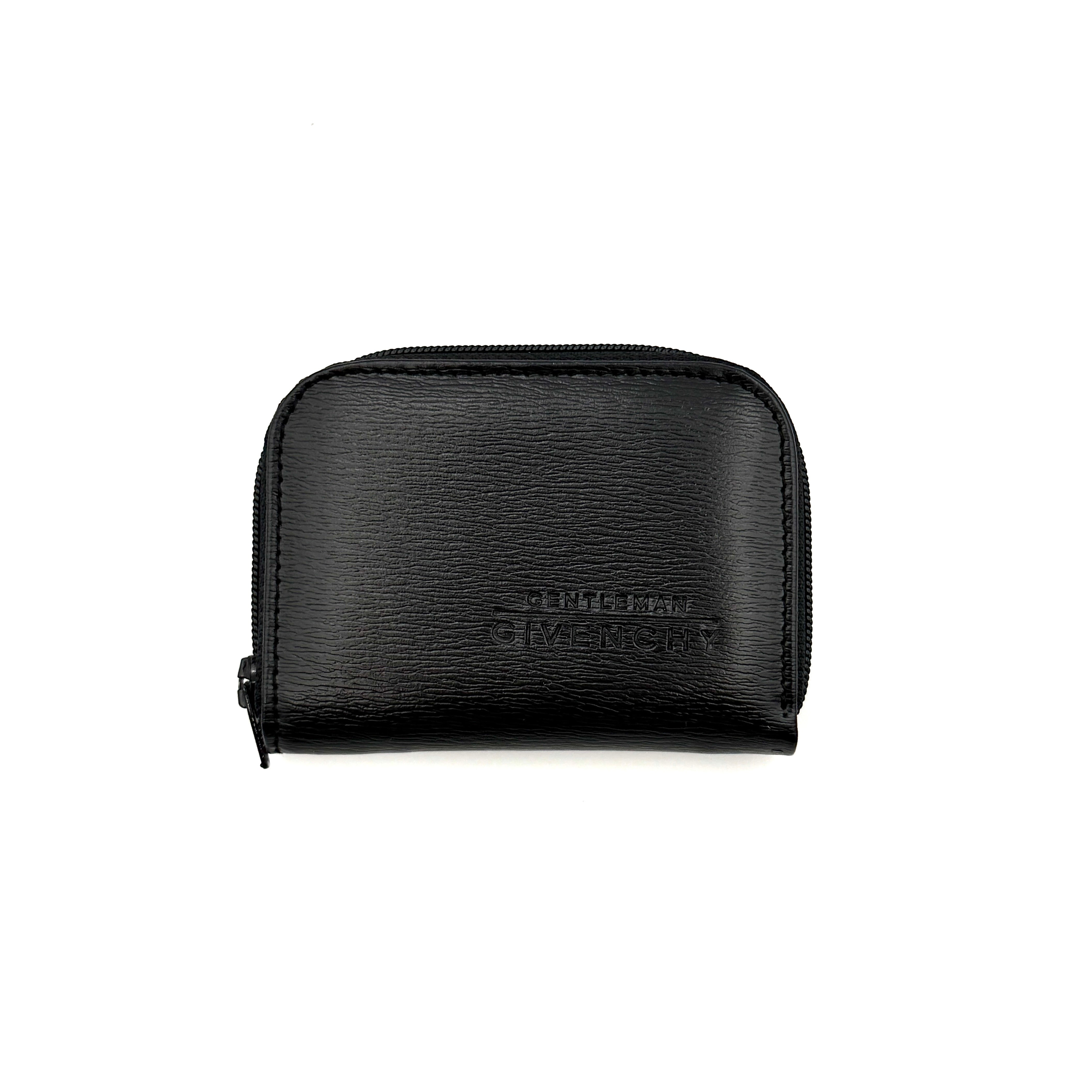 Givenchy Gentleman black leather coin purse with zip-around closure, shown against a white background.