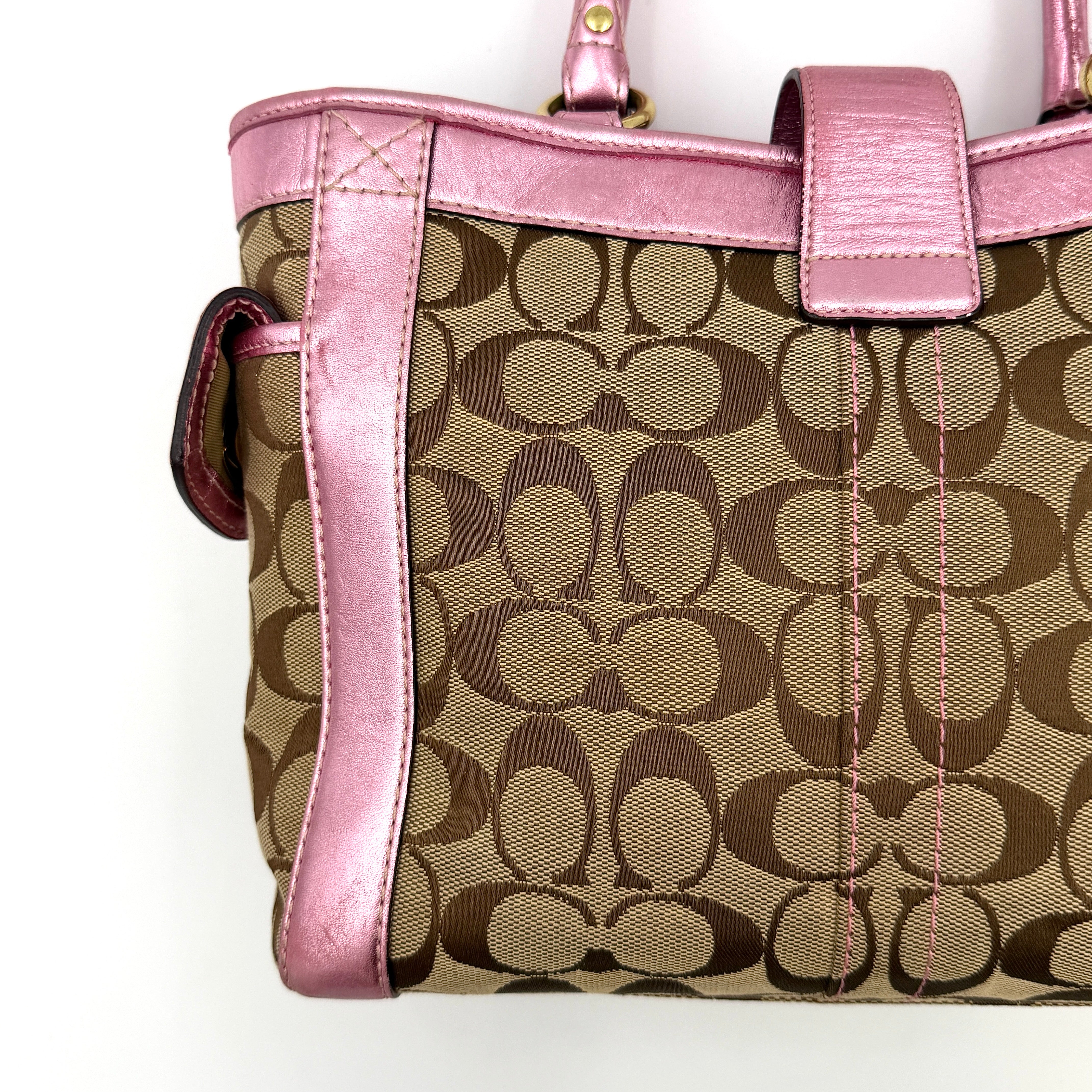 Coach Soho Buckle Tote featuring baby pink metallic leather trim and beige signature jacquard canvas with gold-tone hardware.