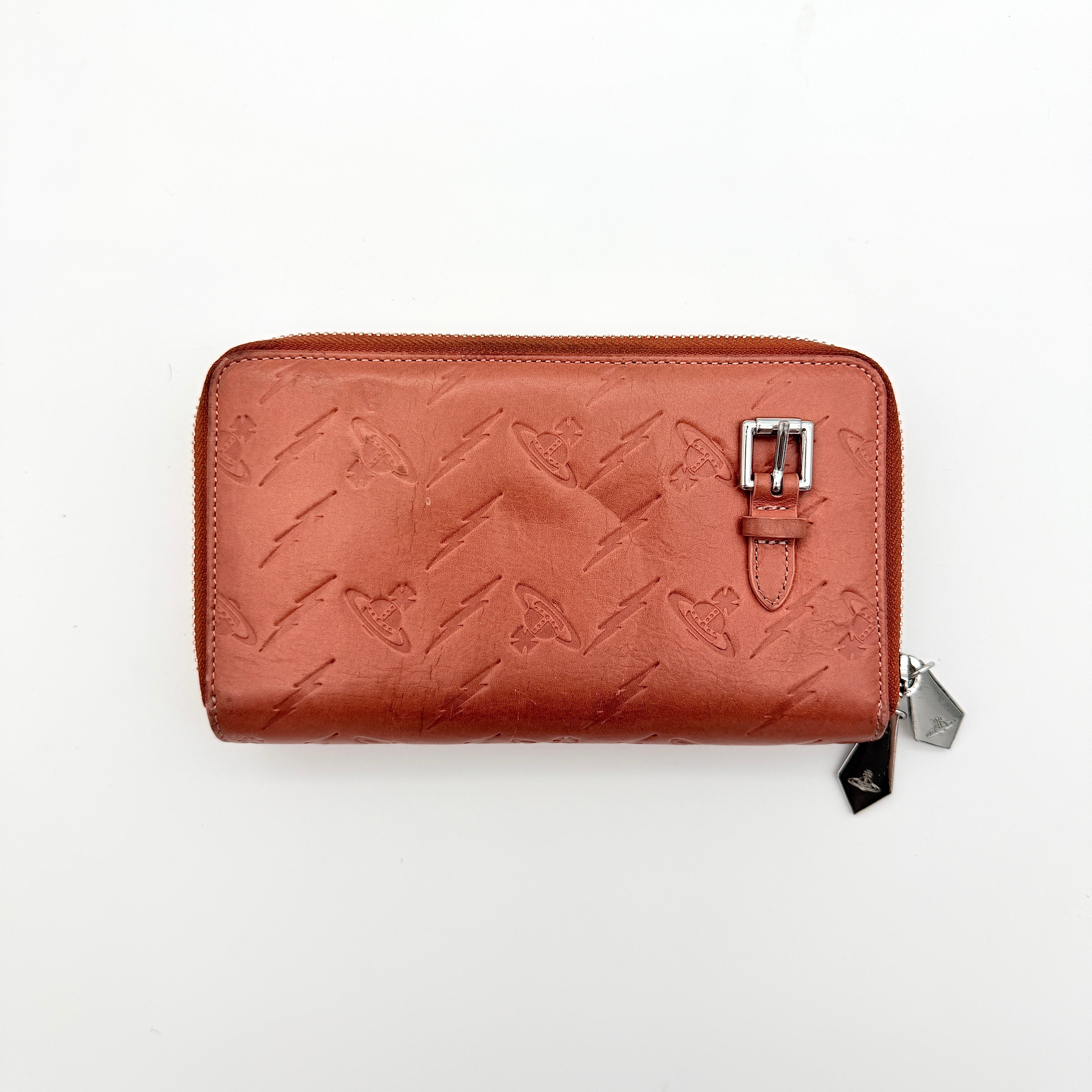 Vivienne Westwood 2Way Signature Orb Embossed Shoulder Wallet in coral pink leather with removable shoulder strap, shown with silver hardware.