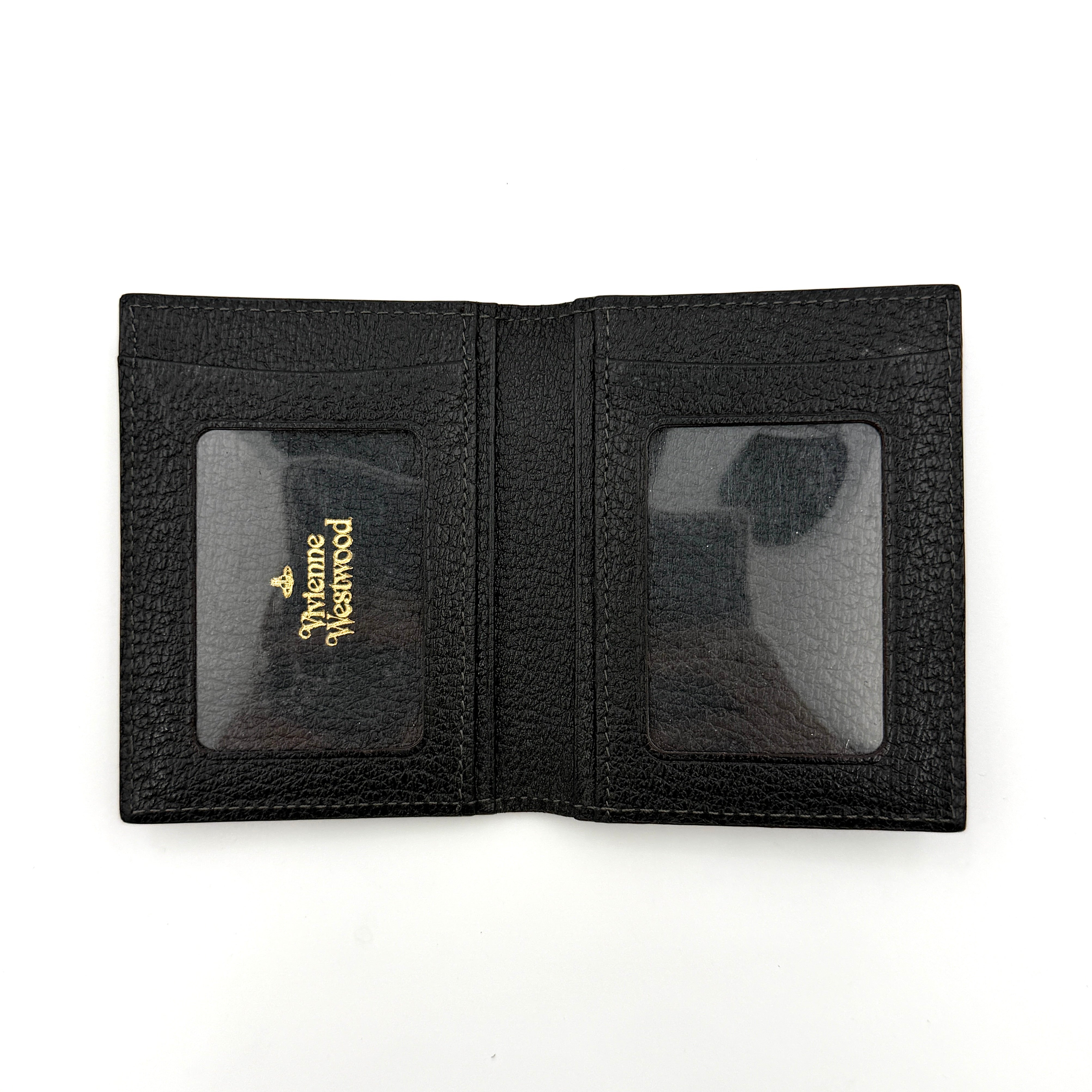 Vivienne Westwood black grained leather cardholder with gold orb emblem on the front flap.
