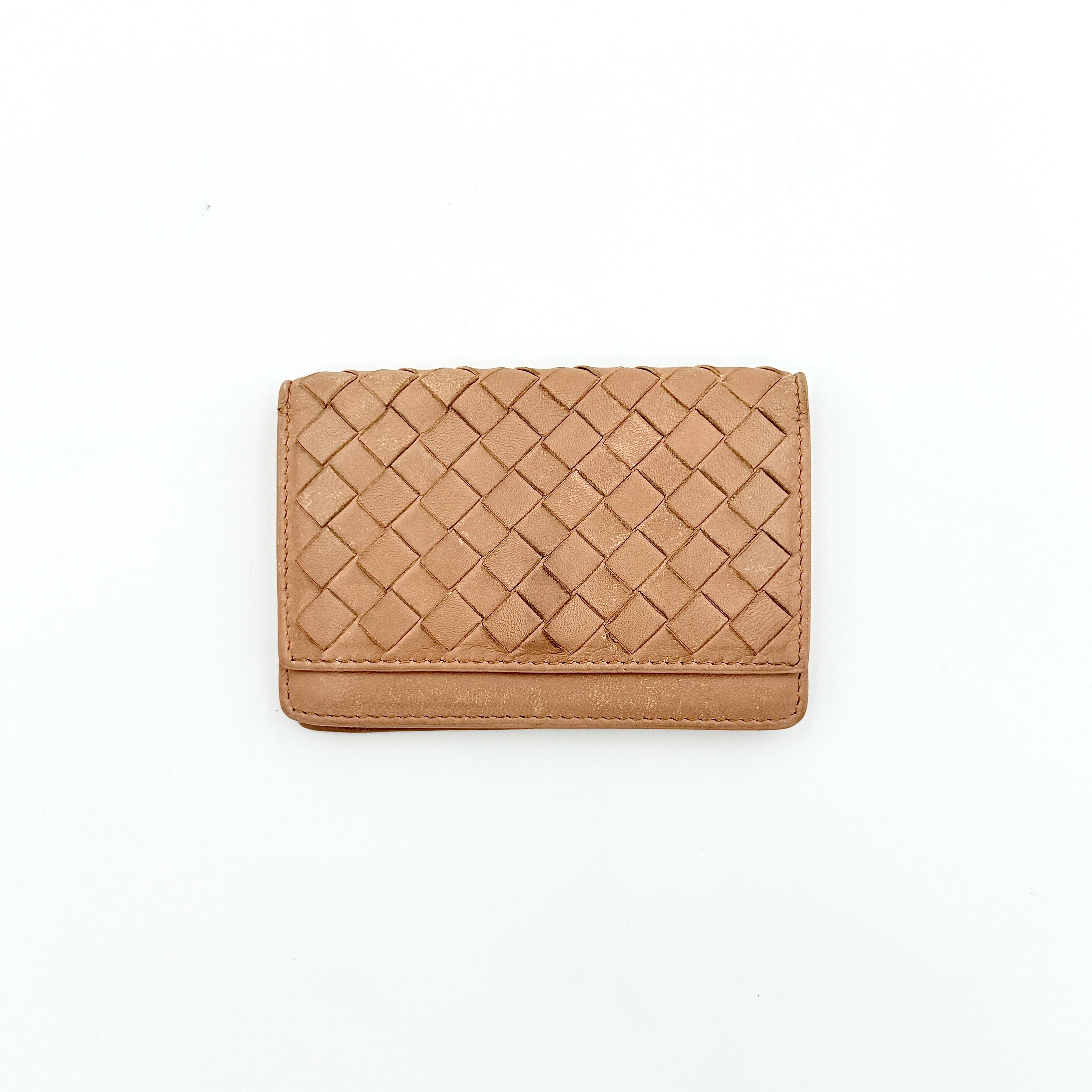 Bottega Veneta beige intrecciato leather card holder with woven front panel, shown on a plain background.
