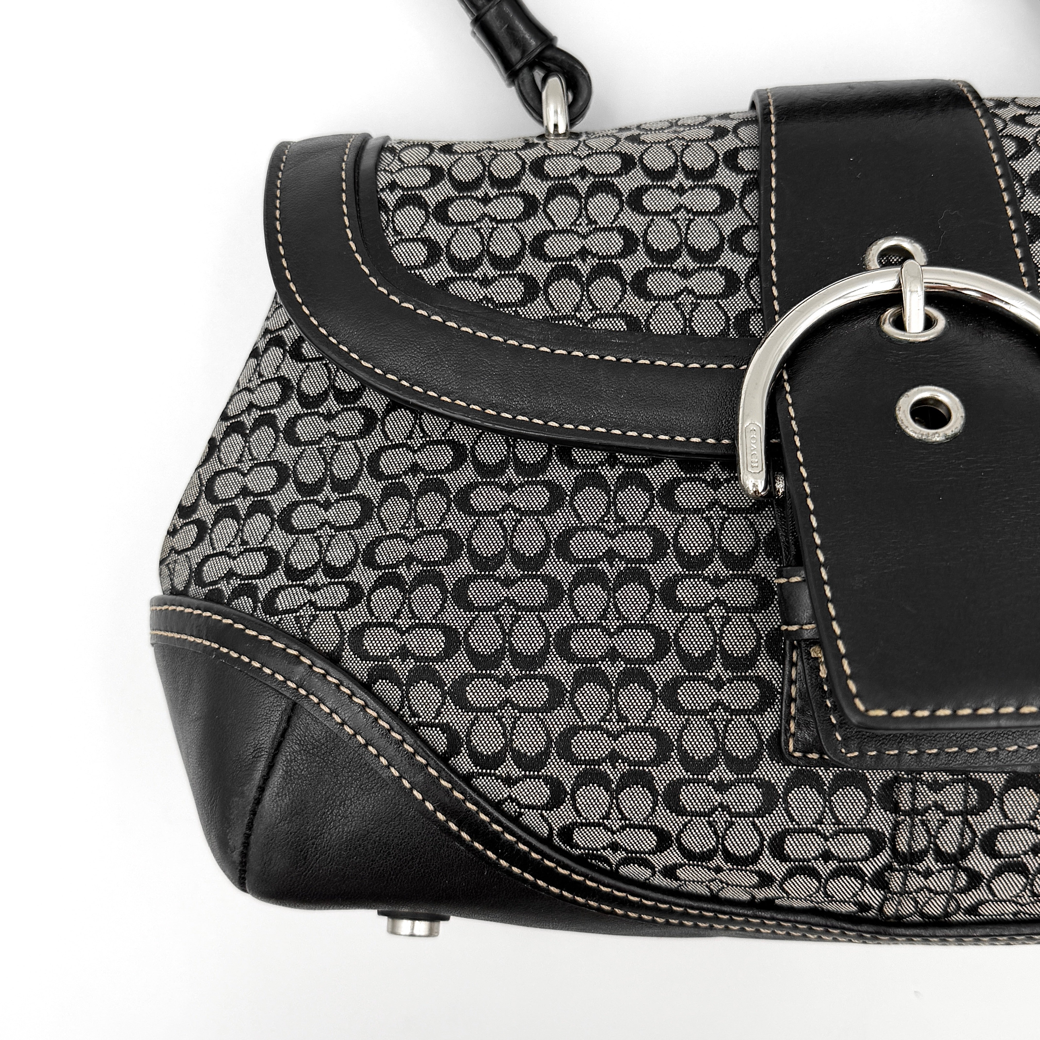 Coach Y2K Signature Soho Shoulder Bag in grey and black canvas with black leather trim and silver hardware, top handle style.