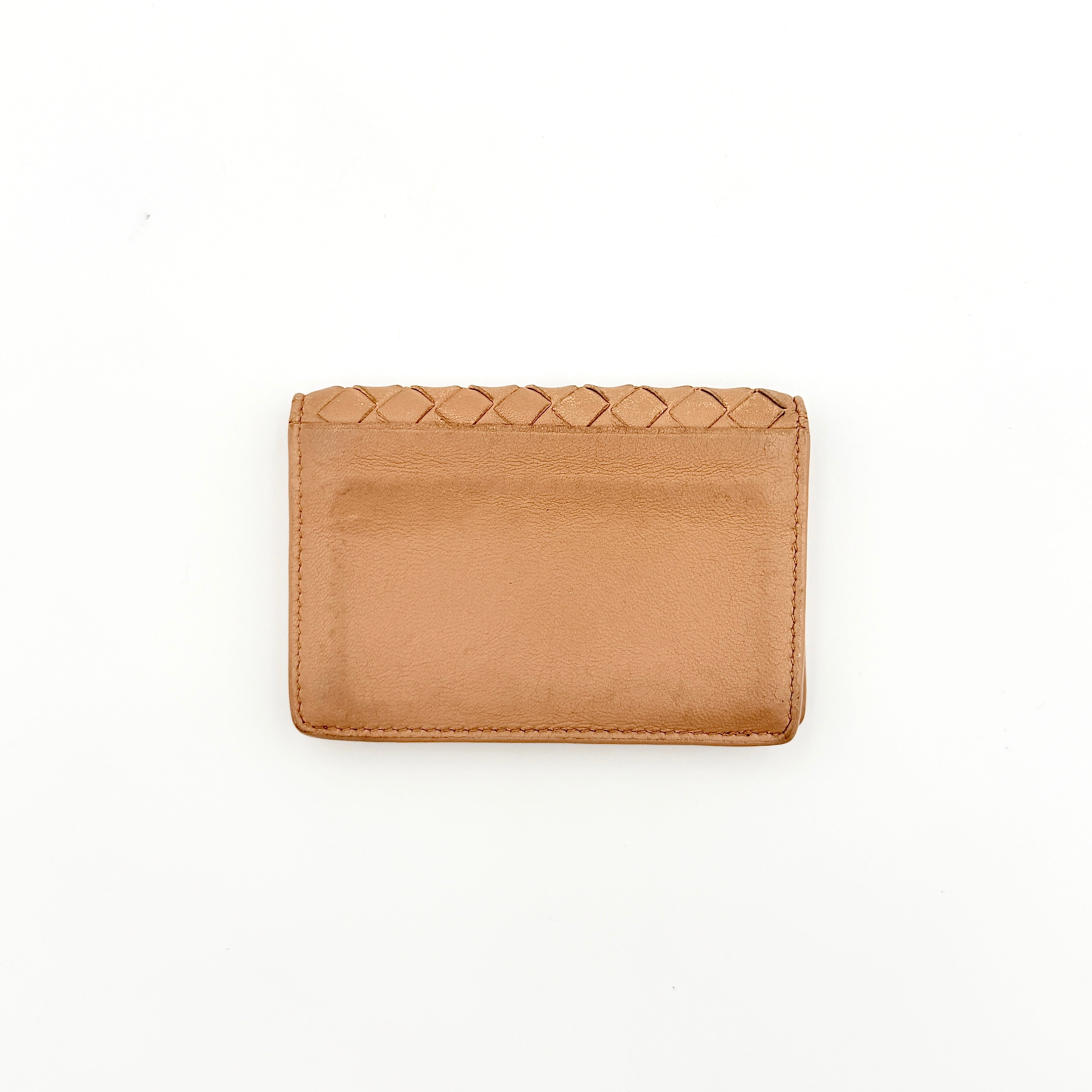 Bottega Veneta beige intrecciato leather card holder with woven front panel, shown on a plain background.