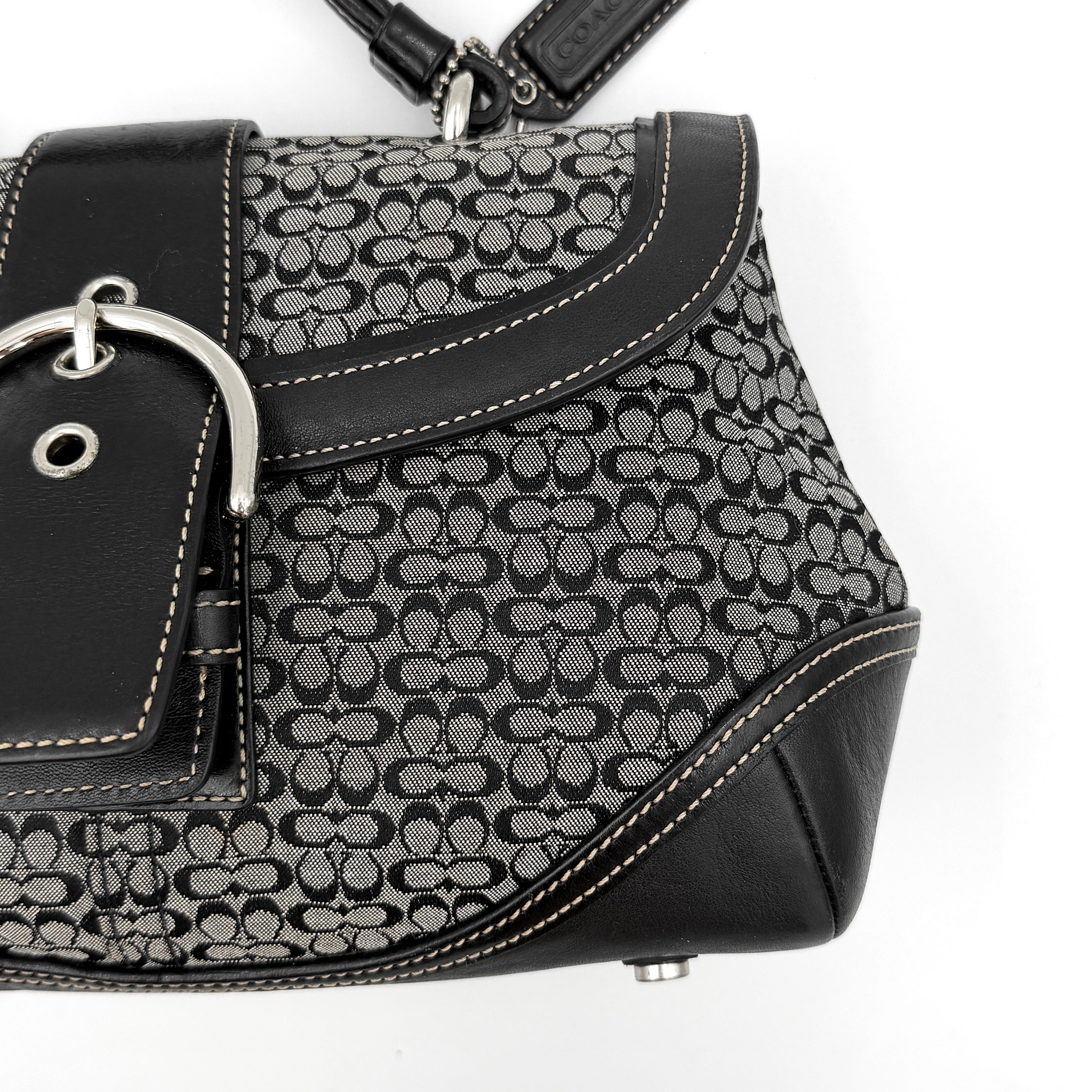 Coach Y2K Signature Soho Shoulder Bag in grey and black canvas with black leather trim and silver hardware, top handle style.