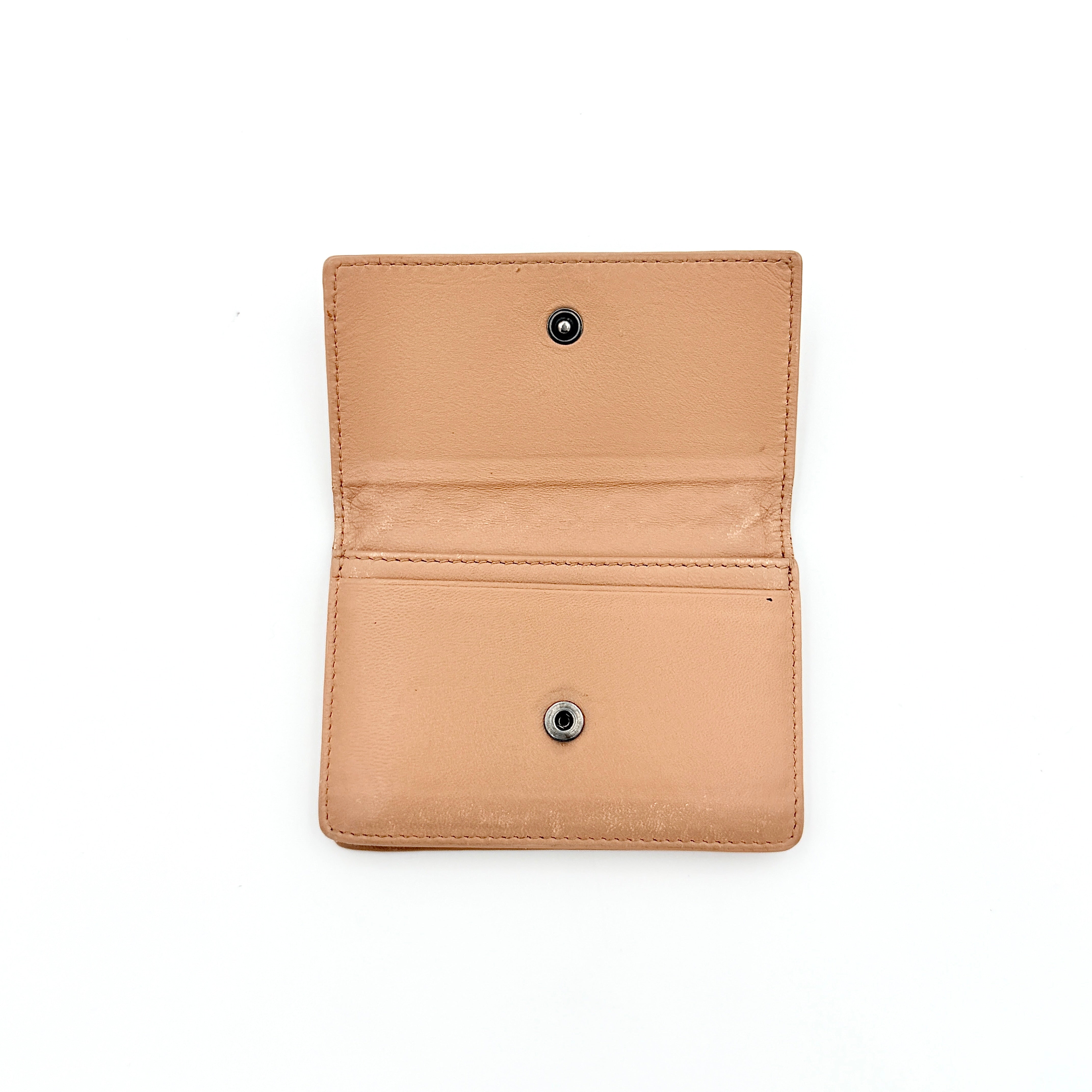 Bottega Veneta beige intrecciato leather card holder with woven front panel, shown on a plain background.