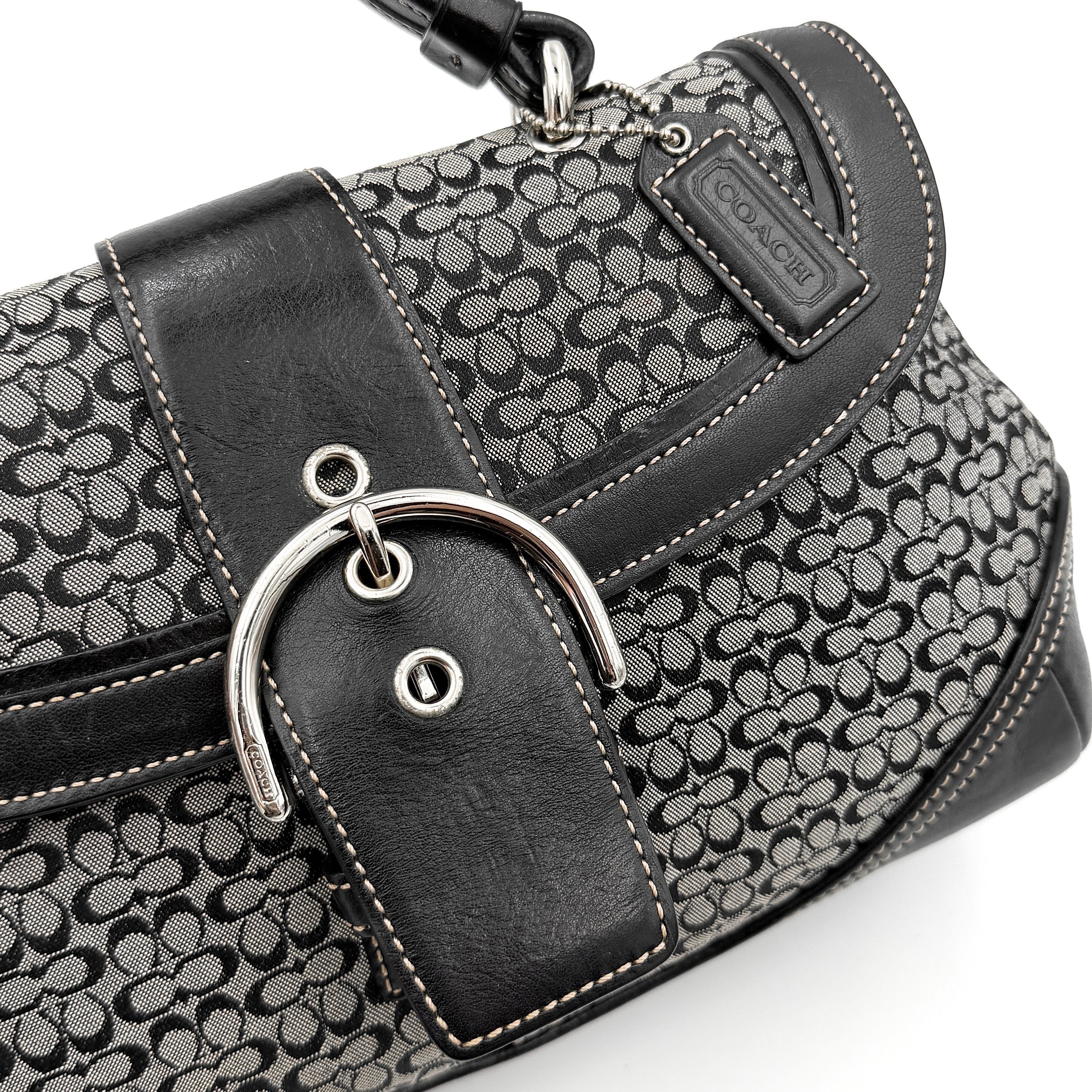 Coach Y2K Signature Soho Shoulder Bag in grey and black canvas with black leather trim and silver hardware, top handle style.