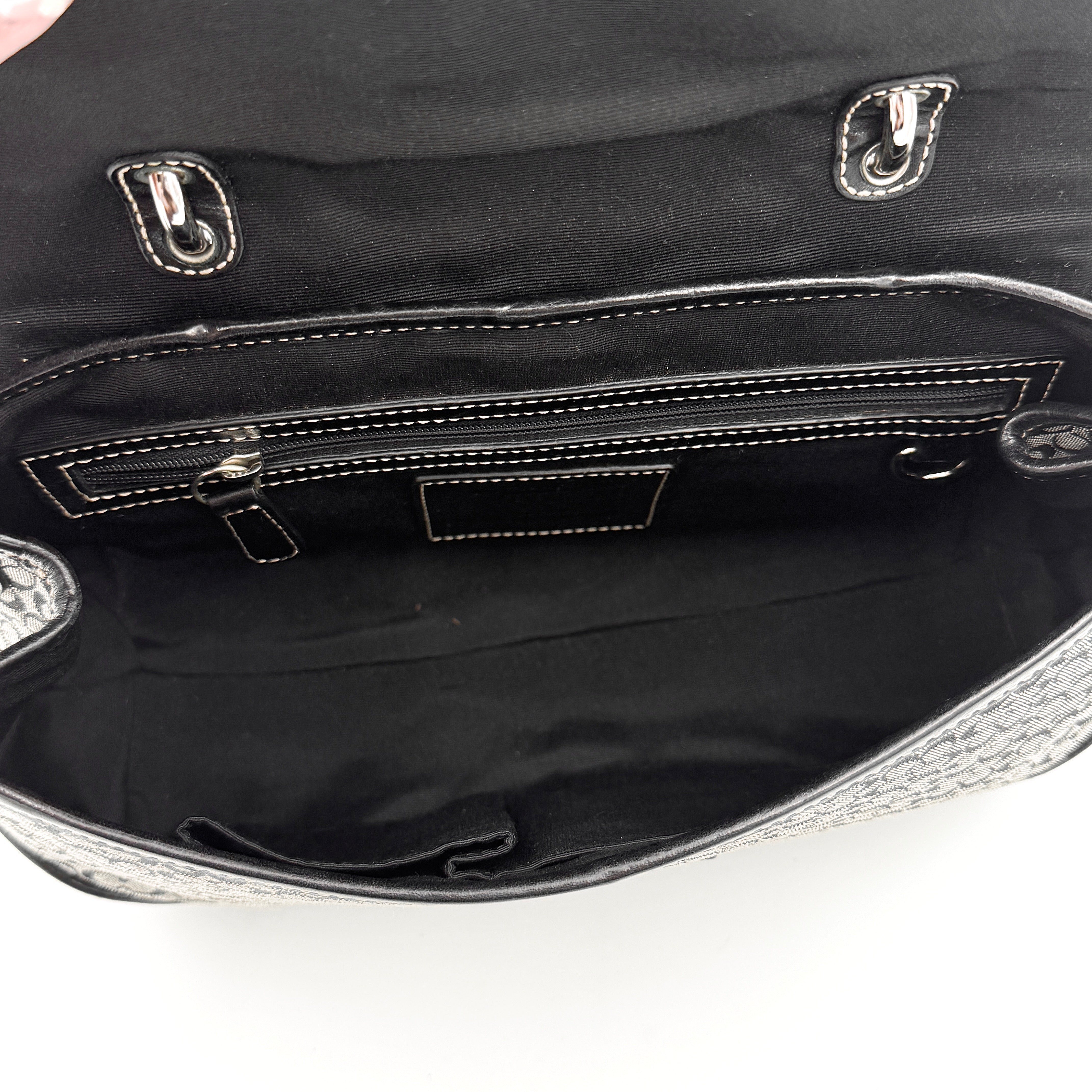 Coach Y2K Signature Soho Shoulder Bag in grey and black canvas with black leather trim and silver hardware, top handle style.