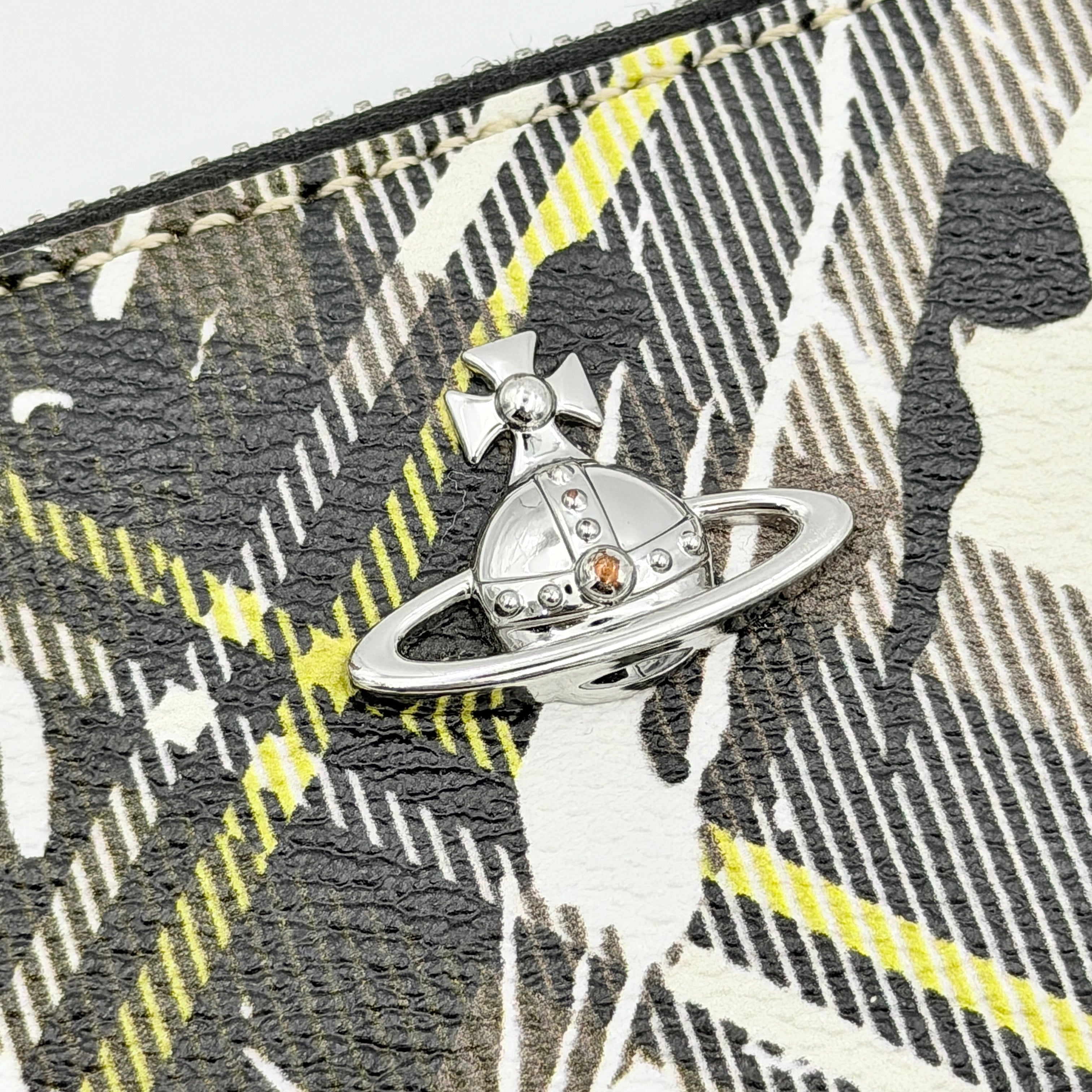Vivienne Westwood Orb Paint Splash Tartan Wallet in multicolor tartan, featuring signature paint effect and silver Orb hardware.