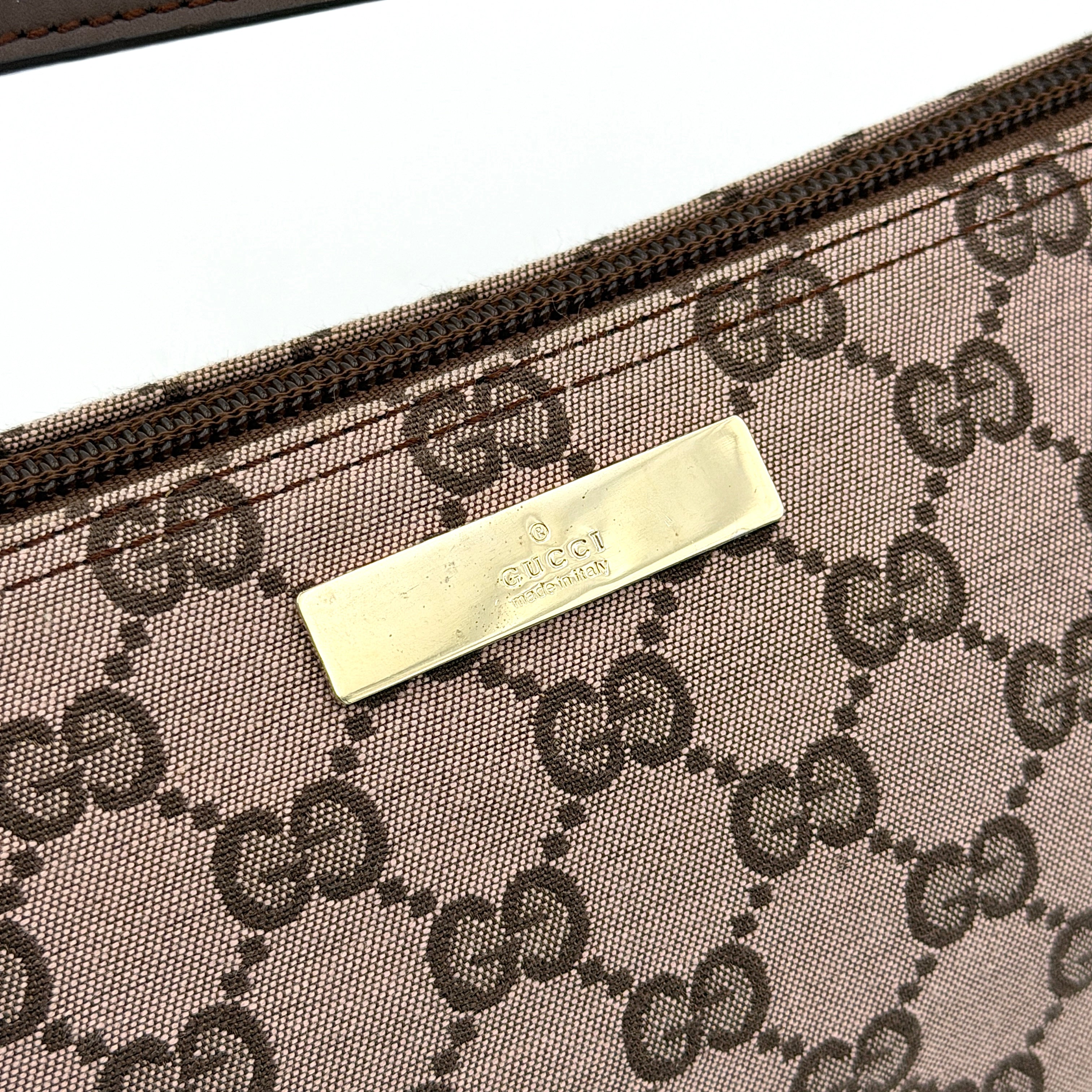 Gucci GG Monogram Pochette Boat Shoulder Bag in light brown canvas with gold-tone hardware and brown leather strap.