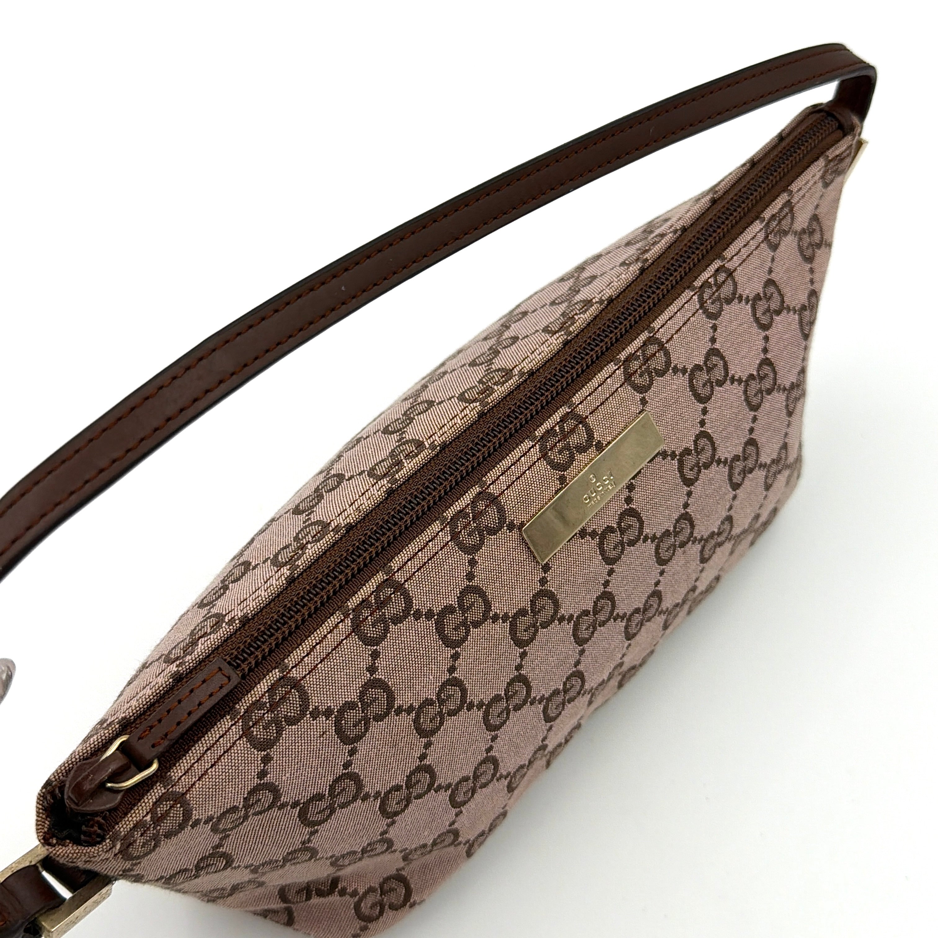 Gucci GG Monogram Pochette Boat Shoulder Bag in light brown canvas with gold-tone hardware and brown leather strap.