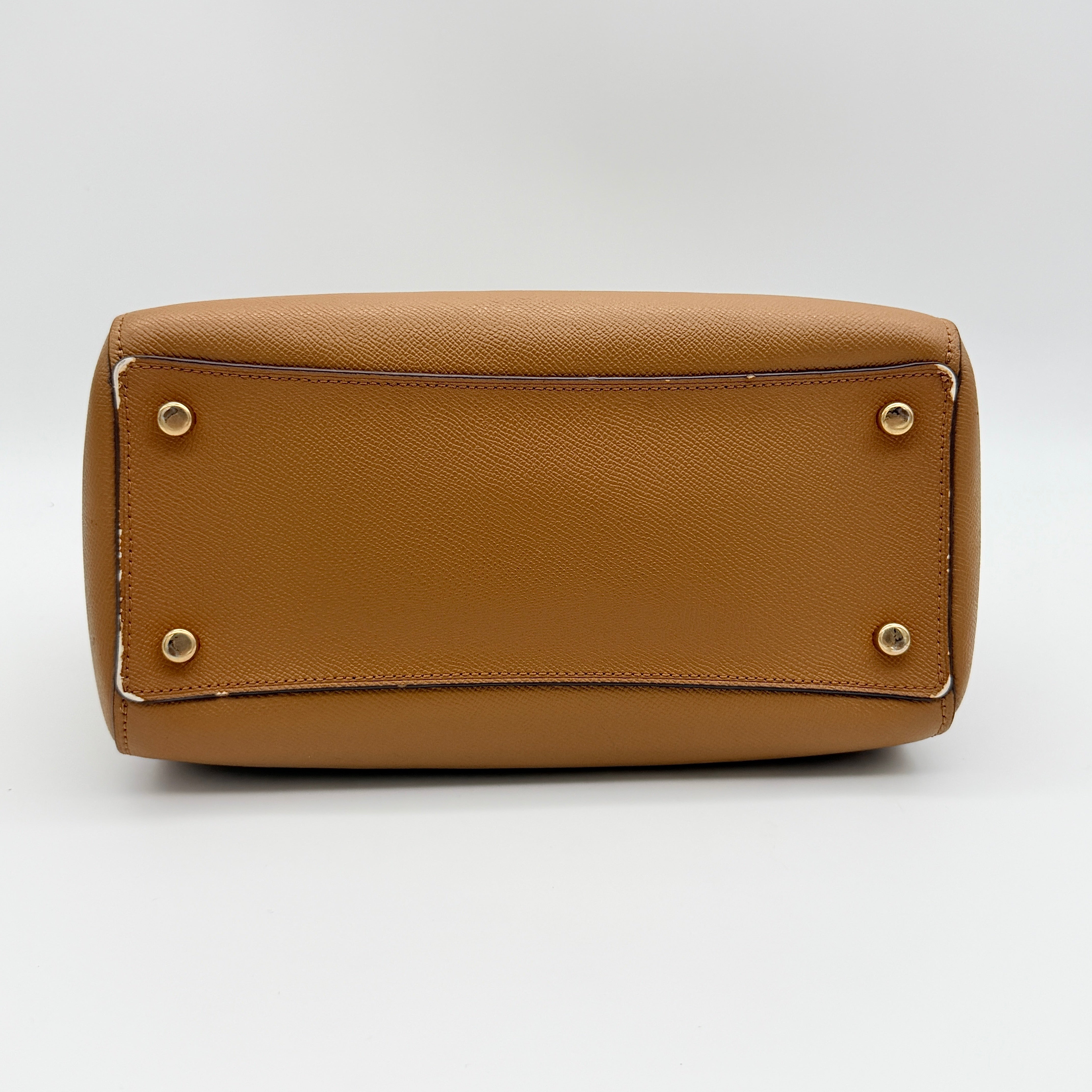 Coach Rowan satchel in brown grained leather with gold hardware, shown with dust bag, strap, and care cards.